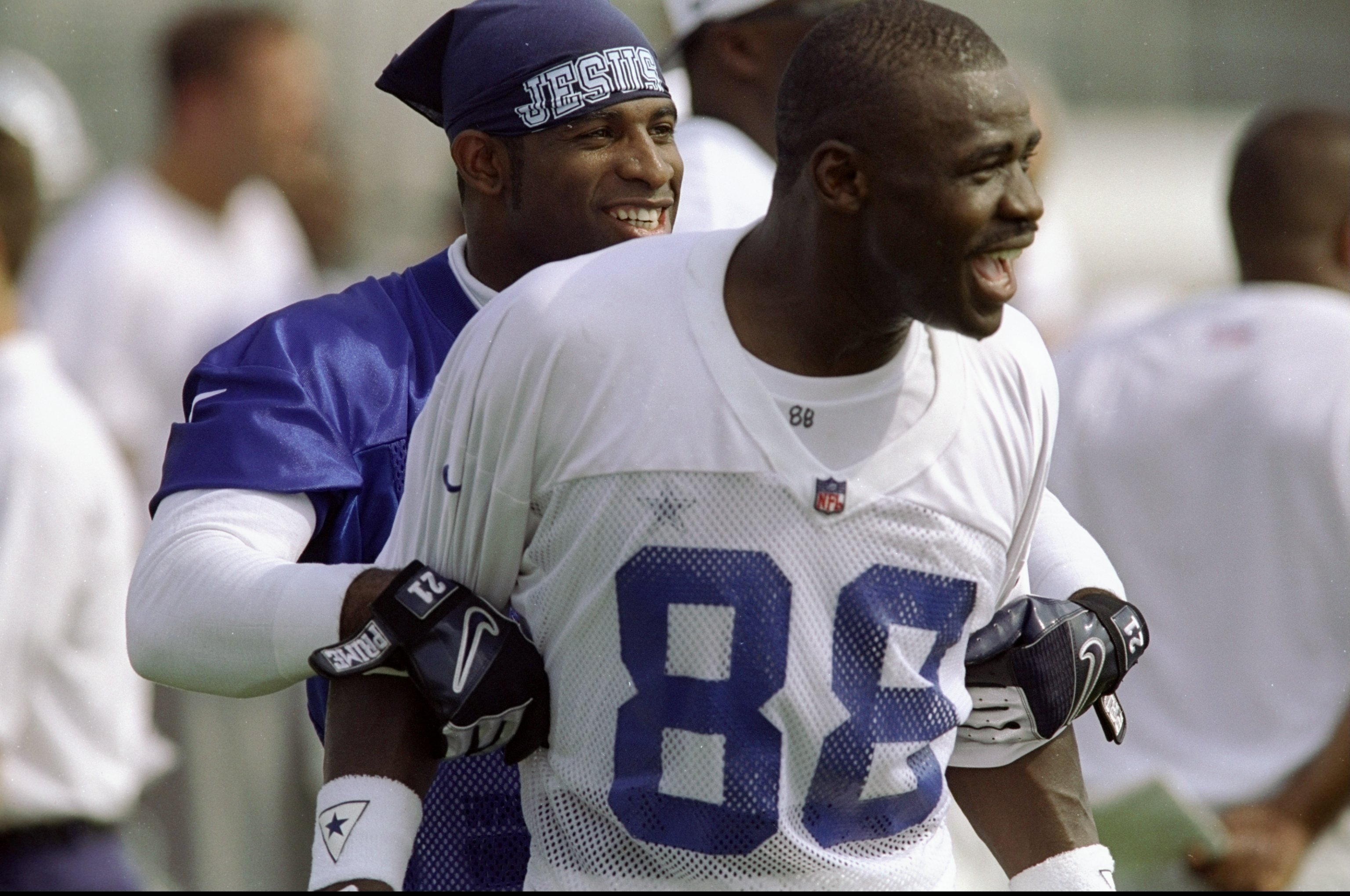 16 Jul 1998:  Wide receiver Michael Irvin #88 and cornerback Deion Sanders #2 of the Dallas Cowboys look on during the 1998 Dallas Cowboys Training Camp at the Midwestern State University in Wichita Falls, Texas. Mandatory Credit: Stephen Dunn  /Allsport