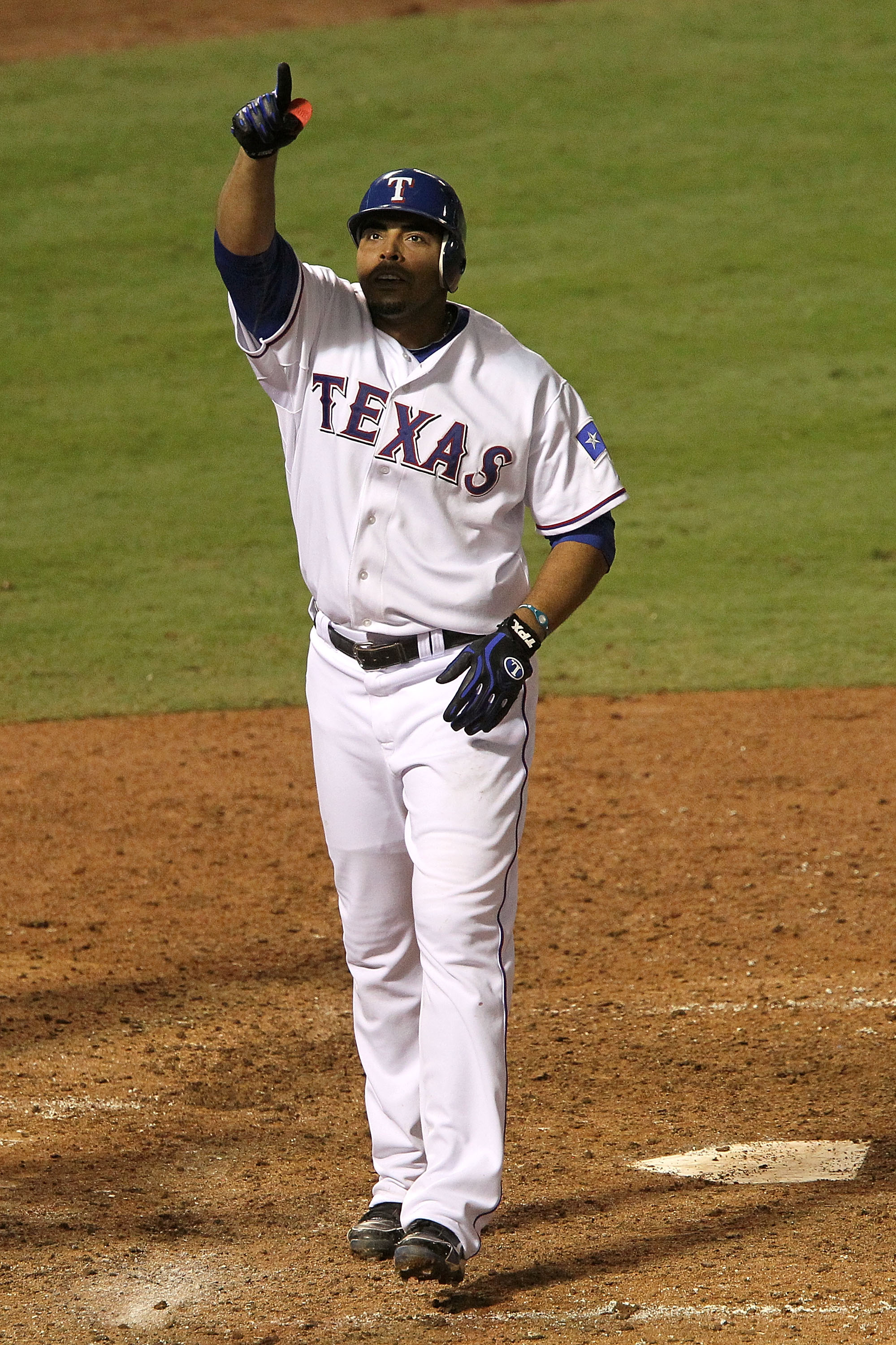 ARLINGTON, TX - OCTOBER 22:  Nelson Cruz #17 of the Texas Rangers celebrates as he crosses home plate and scores on his 2-run home run in the bottom of the fifth inning against the New York Yankees in Game Six of the ALCS during the 2010 MLB Playoffs at R