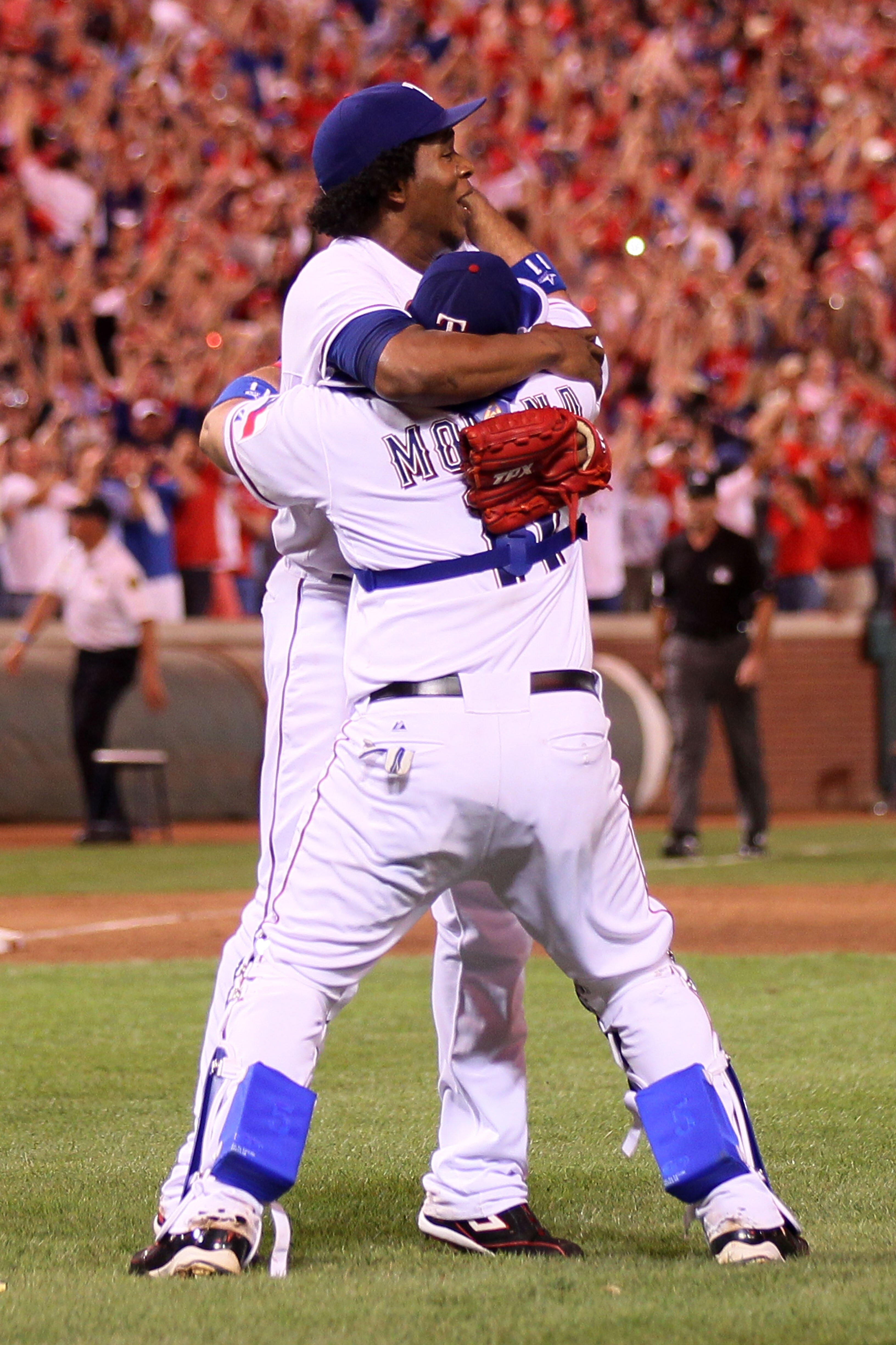 ARLINGTON, TX - OCTOBER 22:  Bengie Molina #11 and Neftali Feliz #30 of the Texas Rangers celebrate after defeating the New York Yankees 6-1 in Game Six of the ALCS during the 2010 MLB Playoffs at Rangers Ballpark in Arlington on October 22, 2010 in Arlin