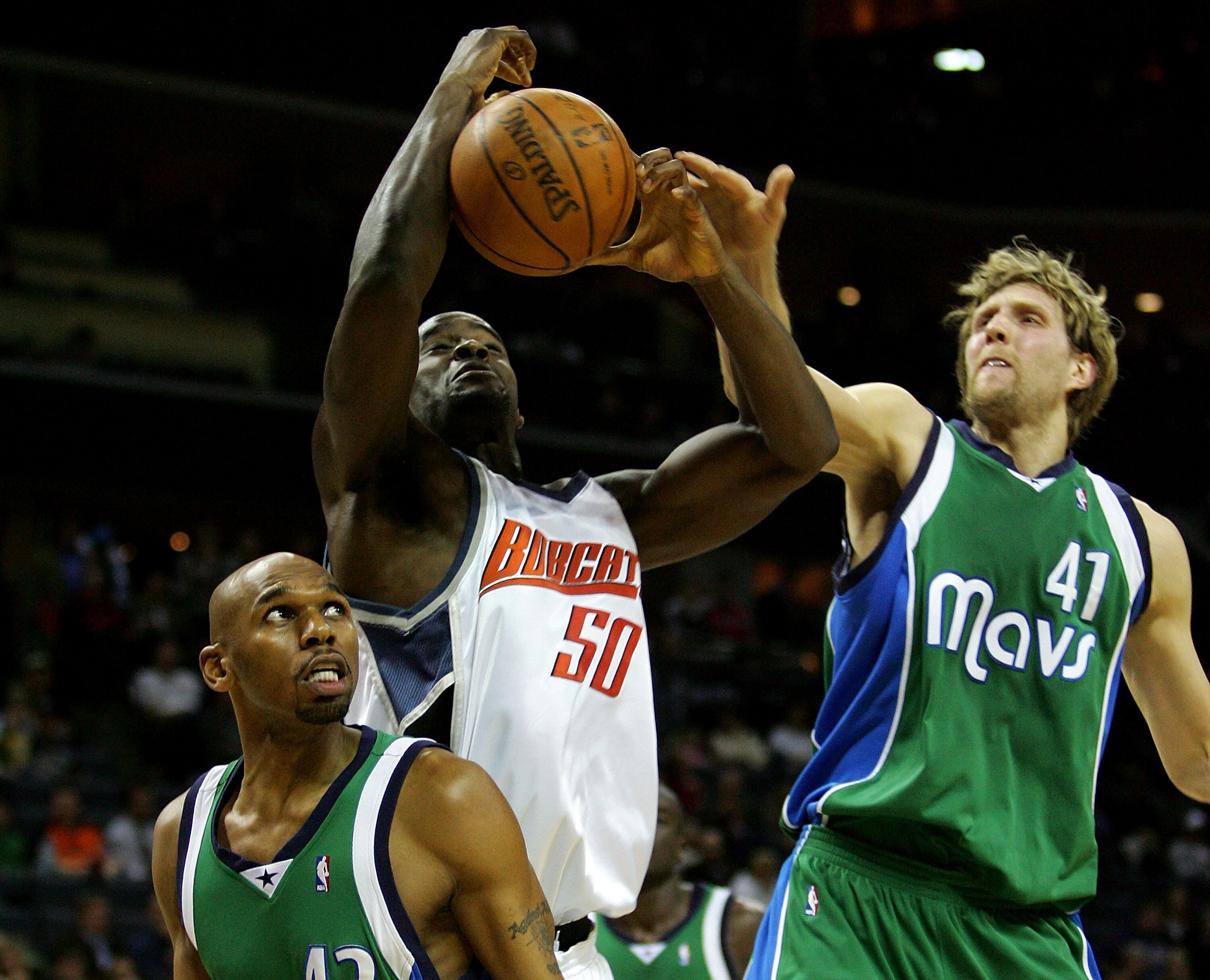 CHARLOTTE, NC - JANUARY 23:  Dirk Nowitzki #41 and Jerry Stackhouse #42 of the Dallas Mavericks defend against Emeka Okafor #50 of Charlotte Bobcats during a game at Bobcats Arena on January 23, 2008 in Charlotte, North Carolina.  (Photo by Streeter Lecka