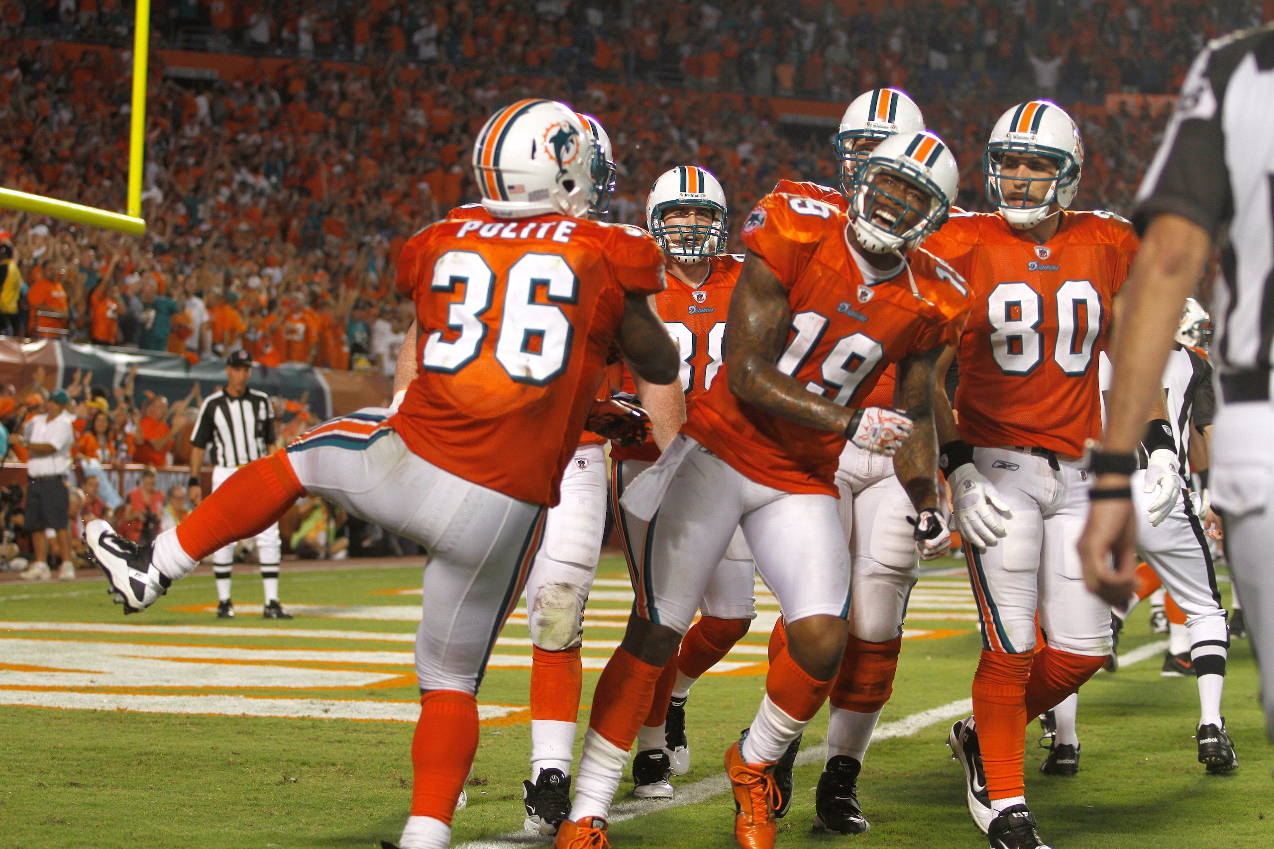 MIAMI - SEPTEMBER 26: ReceiverBrandon Marshall #19 of the Miami Dolphins celebrates a touchdown against the New York Jets at Sun Life Stadium on September 26, 2010 in Miami, Florida. The Jets won 31-23. (Photo by Marc Serota/Getty Images)