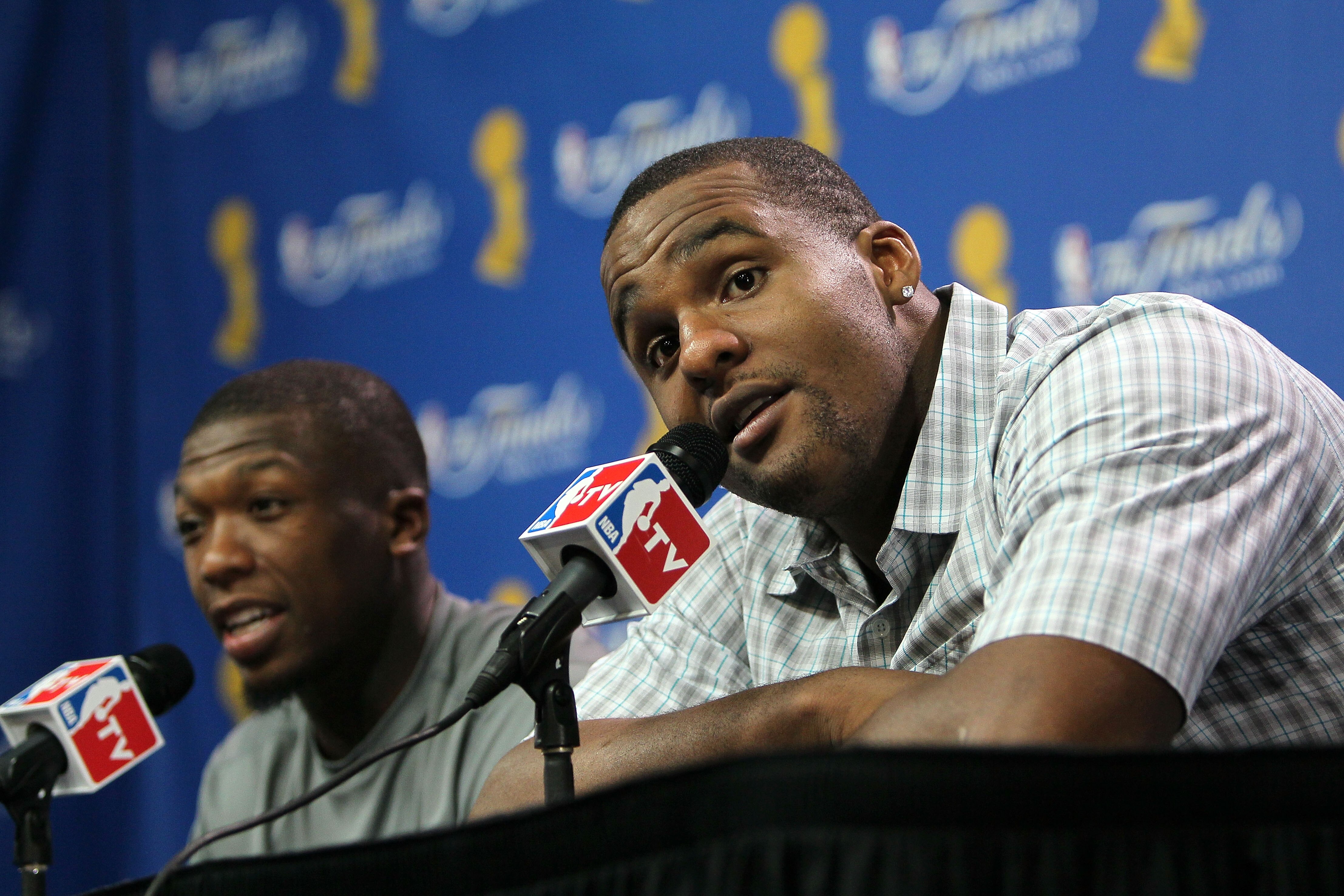 BOSTON - JUNE 10:  Nate Robinson #4 and Glen Davis #11 of the Boston Celtics speak to the media after the Celtics defeated the Los Angeles Lakers during Game Four of the 2010 NBA Finals on June 10, 2010 at TD Garden in Boston, Massachusetts. NOTE TO USER: