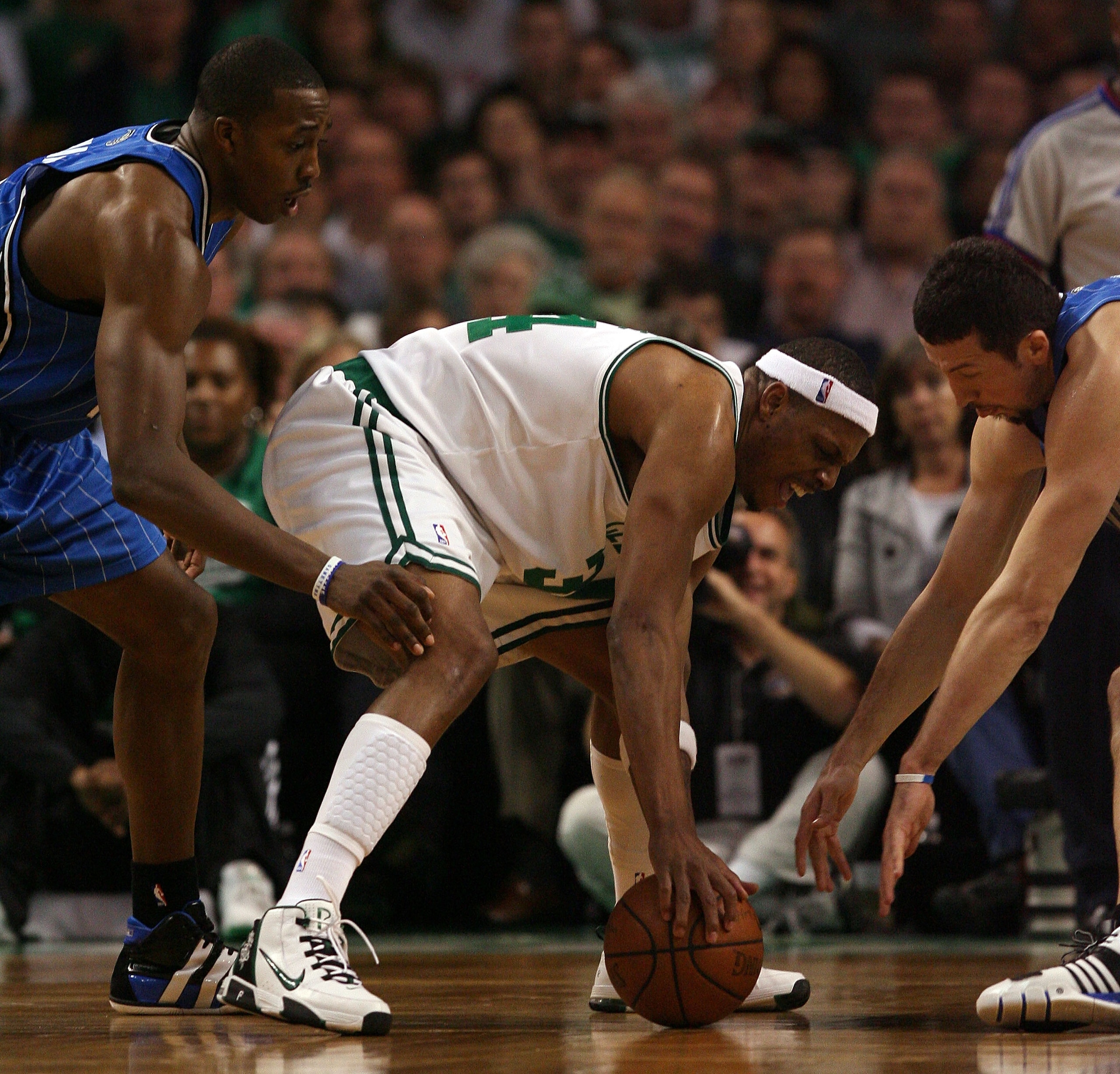 BOSTON - MAY 17:  Paul Pierce #34 of the Boston Celtics loses control of the ball as Dwight Howard #12  and Hedo Turkoglu #15 of the Orlando Magic try get the turnover in Game Seven of the Eastern Conference Semifinals during the 2009 NBA Playoffs at TD B