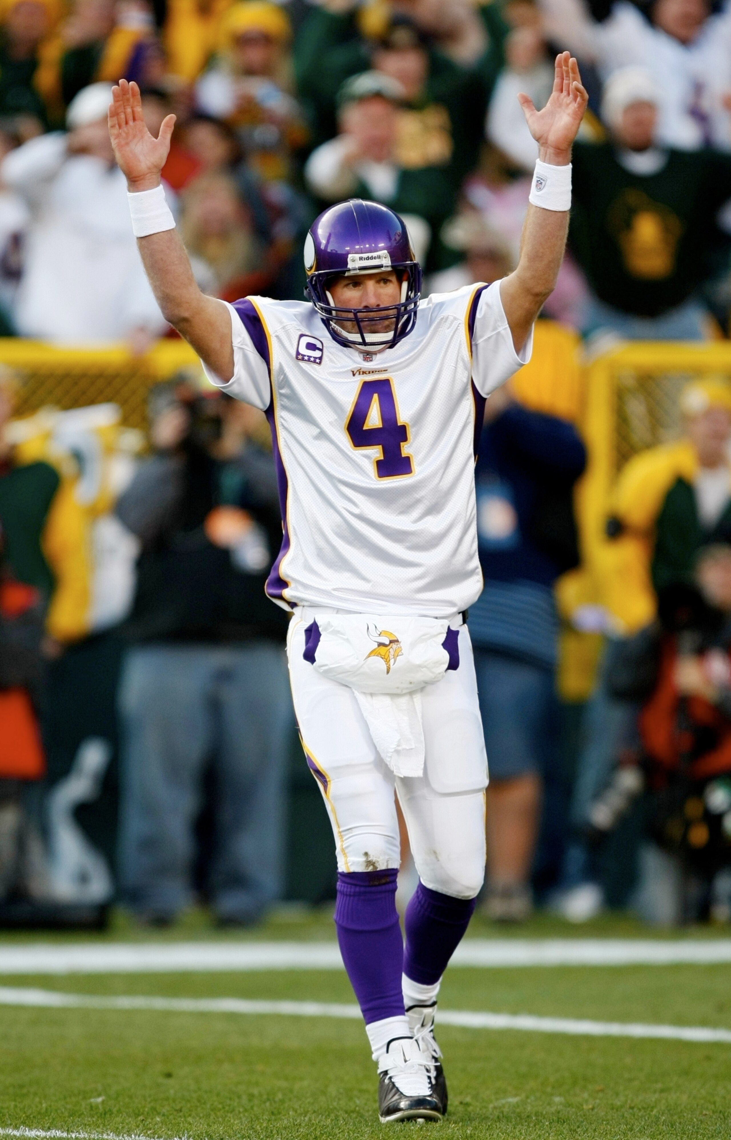 GREEN BAY, WI - NOVEMBER 01: Quarterback Brett Favre #4 of the Minnesota Vikings signals touchdown after teammate Adrian Petersen #20 scored during the first quarter of the game against the Green Bay Packers at Lambeau Field on November 1, 2009 in Green B