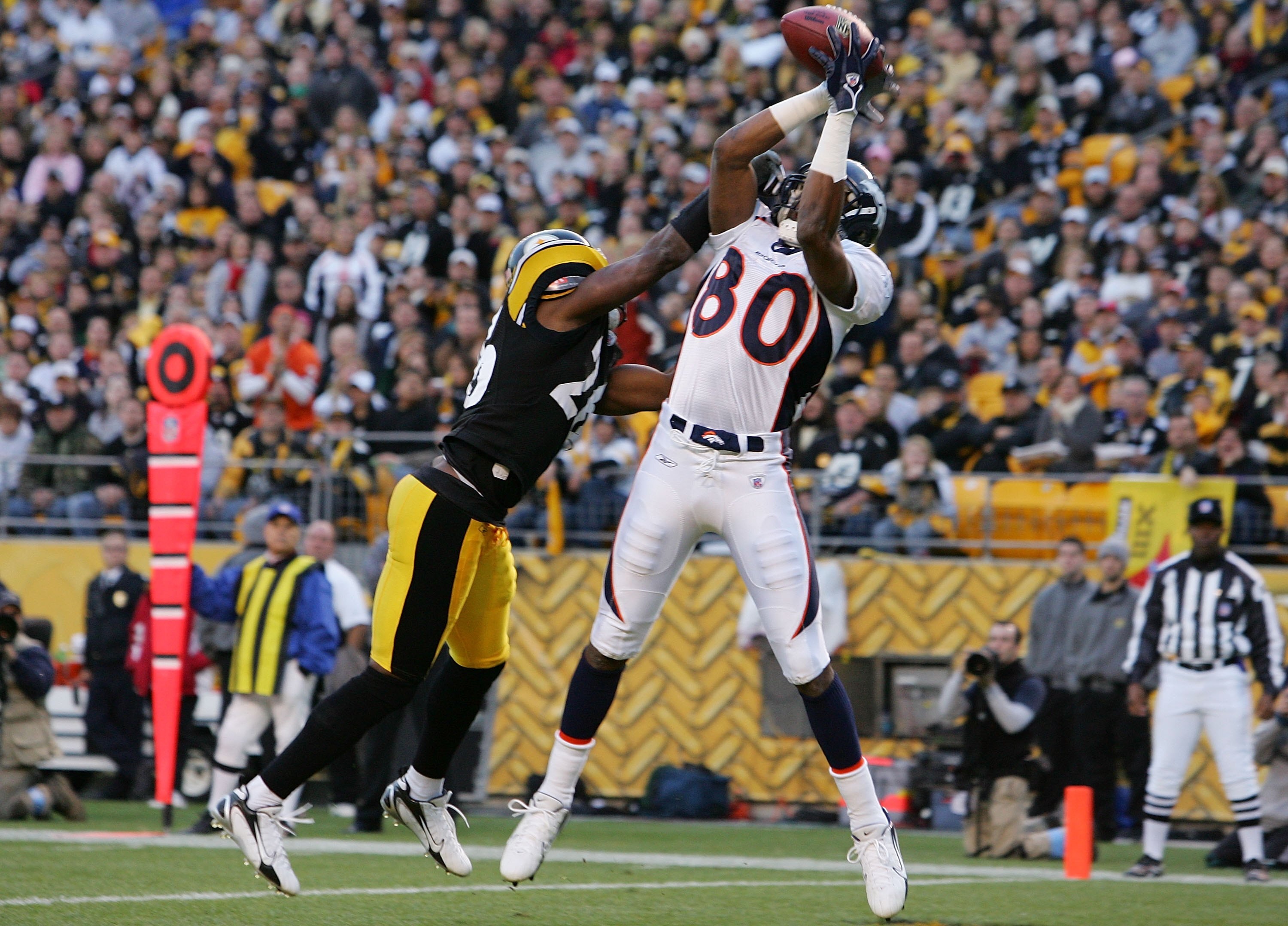 PITTSBURGH - NOVEMBER 05:  Rod Smith #80 of the Denver Broncos catches a touchdown pass in the first quarter against Deshea Townsend #26 of the Pittsburgh Steelers during thier game on November 5, 2006 at Heinz Field in Pittsburgh, Pennsylvania.  (Photo b