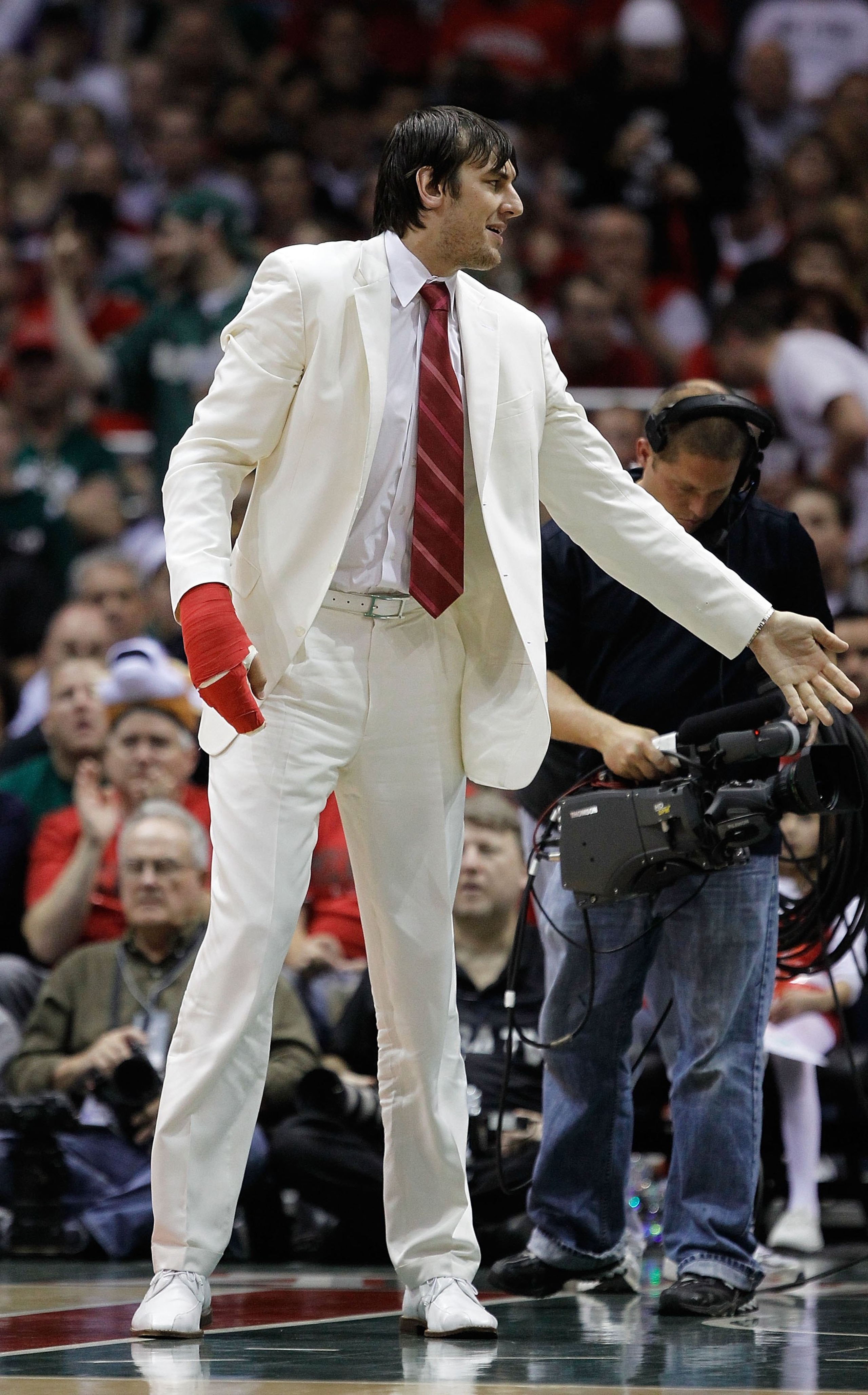 MILWAUKEE - APRIL 30: Injured player Andrew Bogut of the Milwaukee Bucks encourages teammates against the Atlanta Hawks in Game Six of the Eastern Conference Quarterfinals during the 2010 NBA Playoffs at the Bradley Center on April 30, 2010 in Milwaukee, MILWAUKEE - APRIL 30: Injured player Andrew Bogut of the Milwaukee Bucks encourages teammates against the Atlanta Hawks in Game Six of the Eastern Conference Quarterfinals during the 2010 NBA Playoffs at the Bradley Center on April 30, 2010 in Milwaukee,