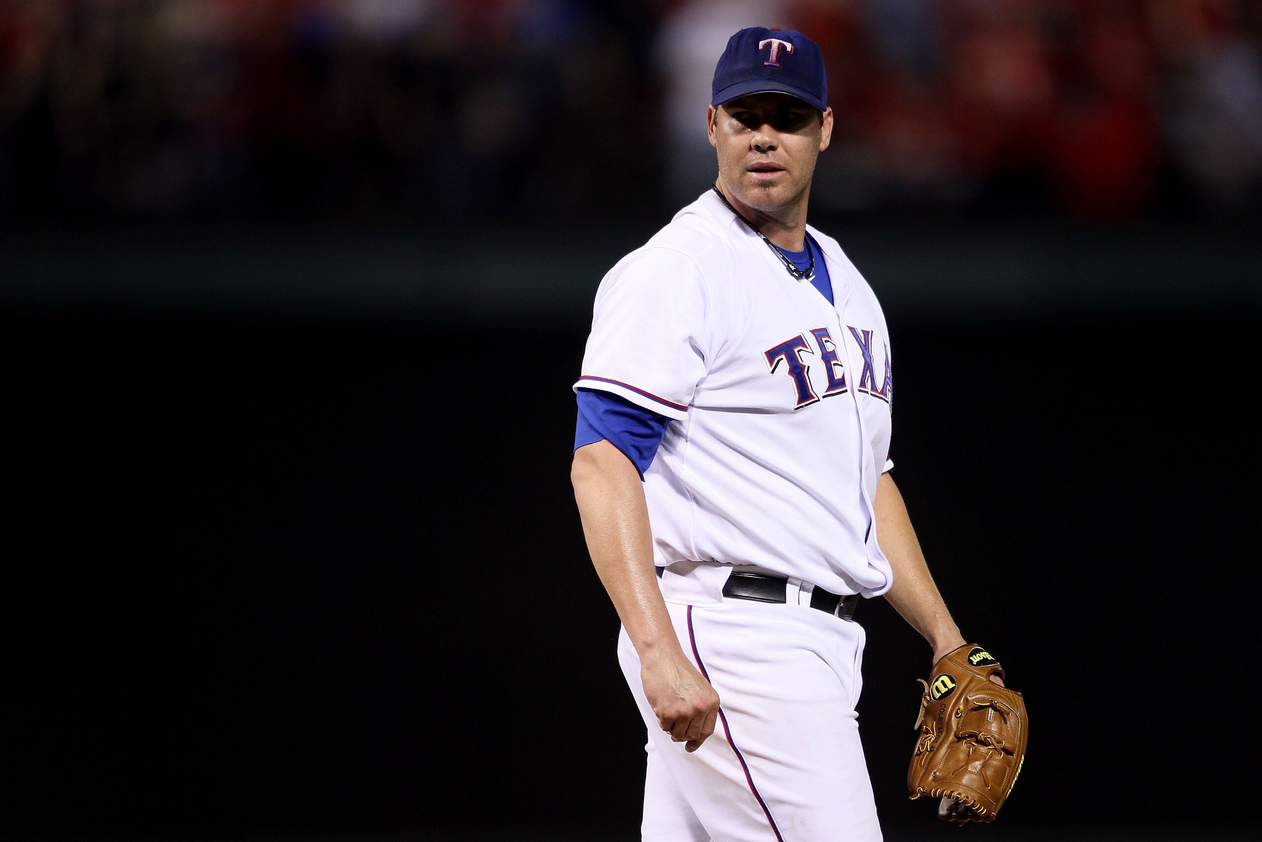 ARLINGTON, TX - OCTOBER 22:  Starting pitcher Colby Lewis #48 of the Texas Rangers looks on against the New York Yankees in Game Six of the ALCS during the 2010 MLB Playoffs at Rangers Ballpark in Arlington on October 22, 2010 in Arlington, Texas.  (Photo