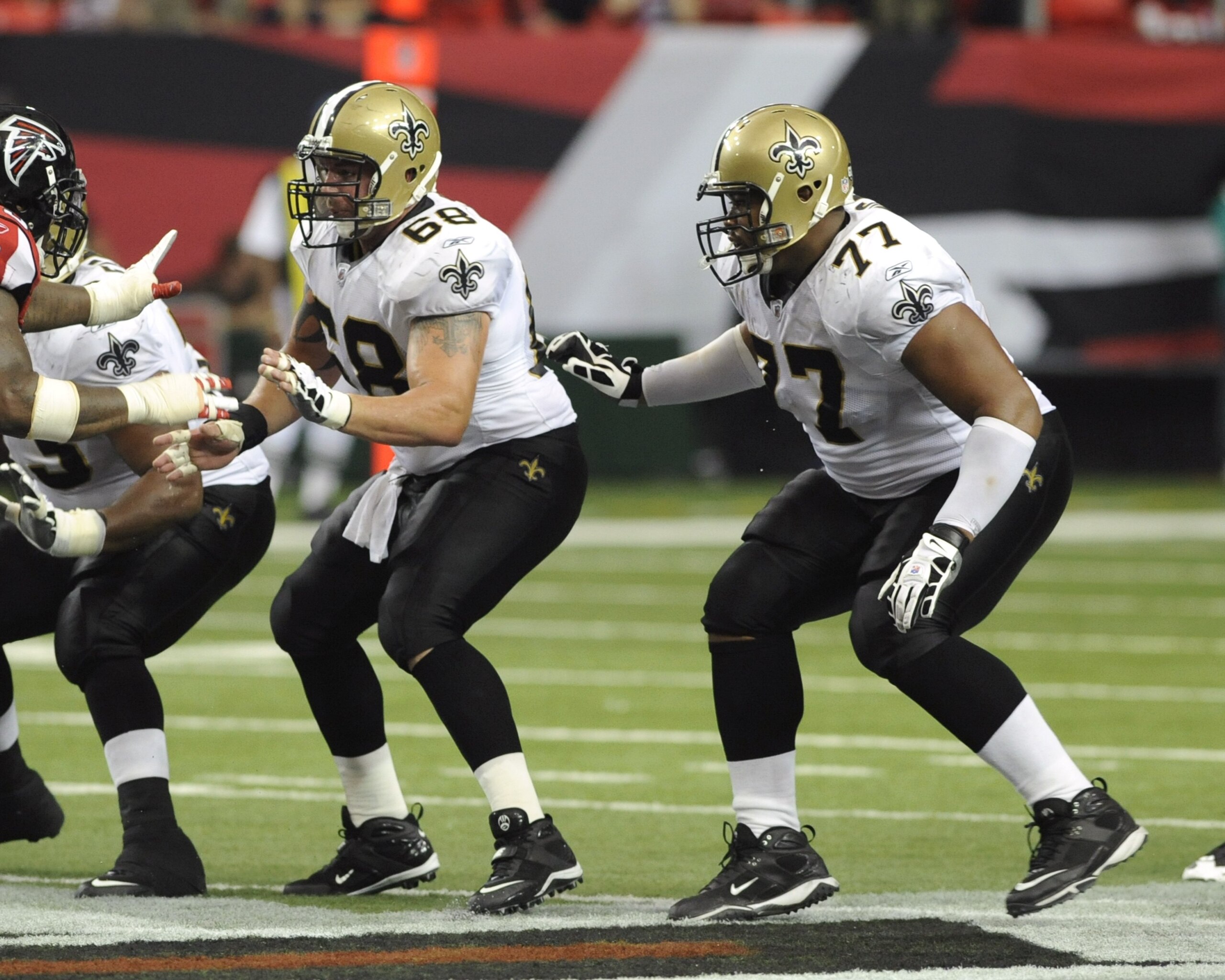 ATLANTA - NOVEMBER 9: Center Matt Lehr #68 and guard Carl Nicks #77 of the New Orleans Saints set to block against the Atlanta Falcons at the Georgia Dome on November 9, 2008 in Atlanta, Georgia.  (Photo by Al Messerschmidt/Getty Images)