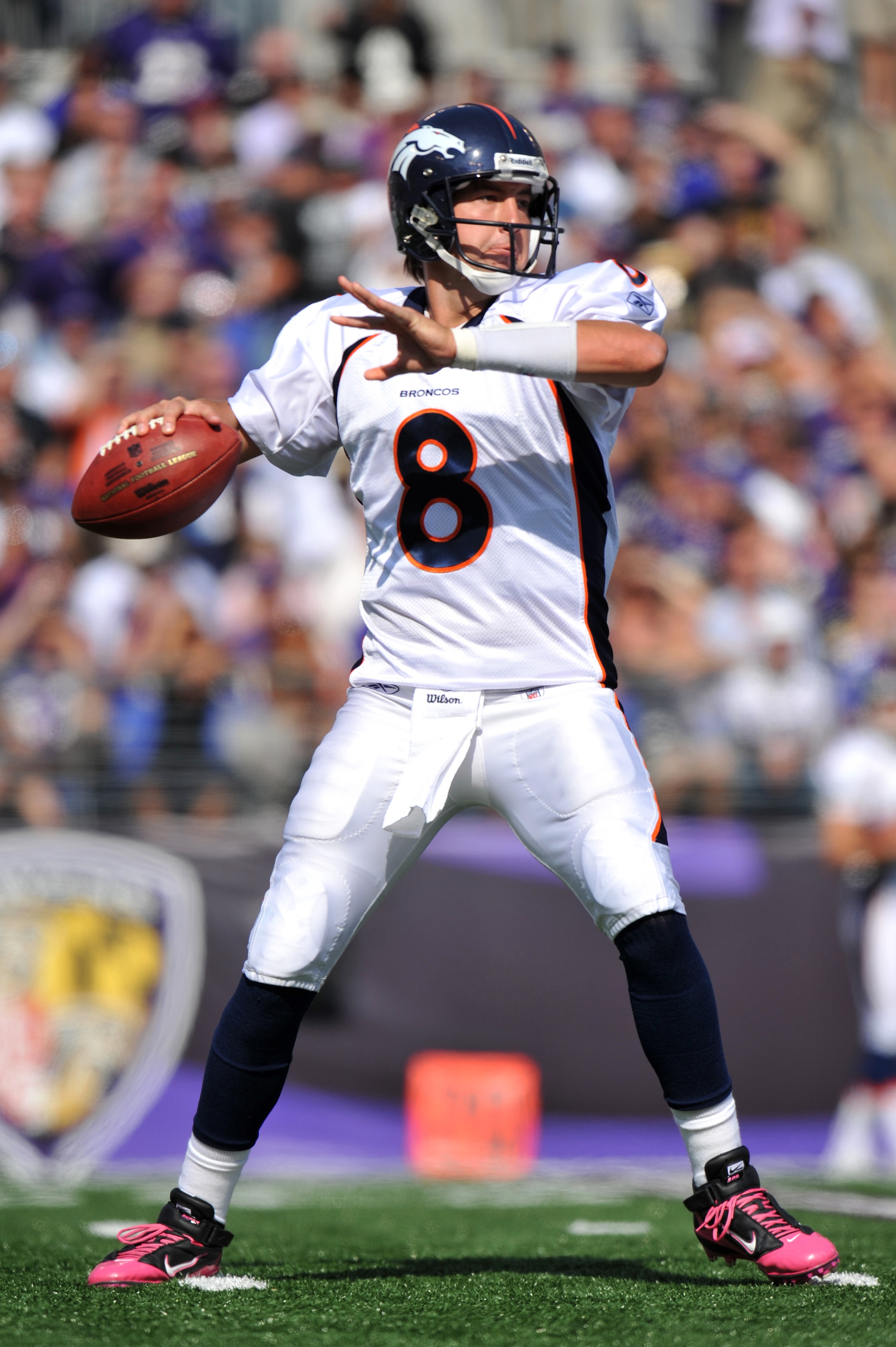 BALTIMORE, MD - OCTOBER 10: Kyle Orton #8 of the Denver Broncos passes against the Baltimore Ravens at M&T Bank Stadium on October 10, 2010 in Baltimore, Maryland. Players wore pink in recognition of Breast Cancer Awareness Month. The Ravens defeated the 
