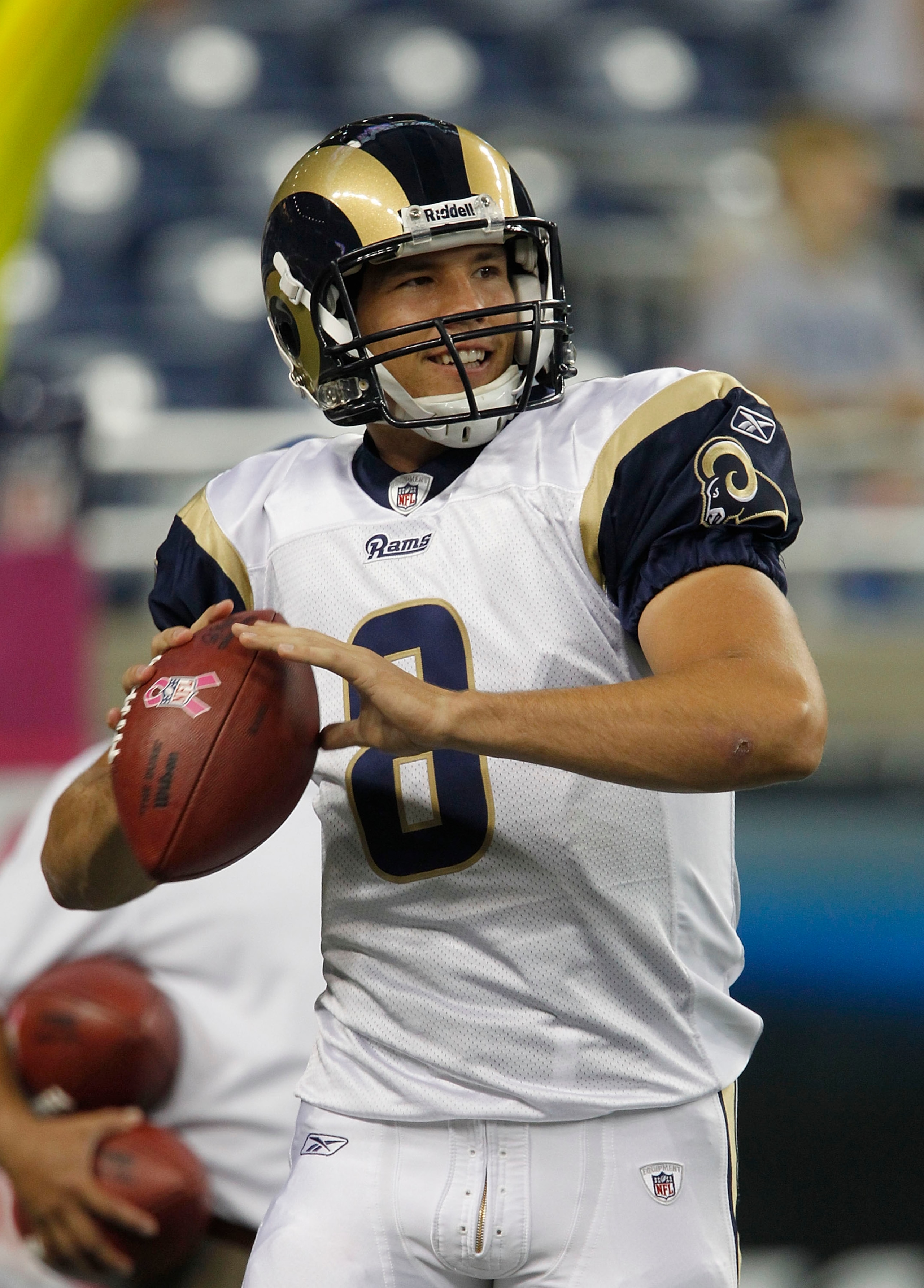 DETROIT - OCTOBER 10: Sam Bradford #8 of the St. Louis Rams warms up prior to the start of the game against the Detroit Lions at Ford Field on October 10, 2010 in Detroit, Michigan.  (Photo by Leon Halip/Getty Images)