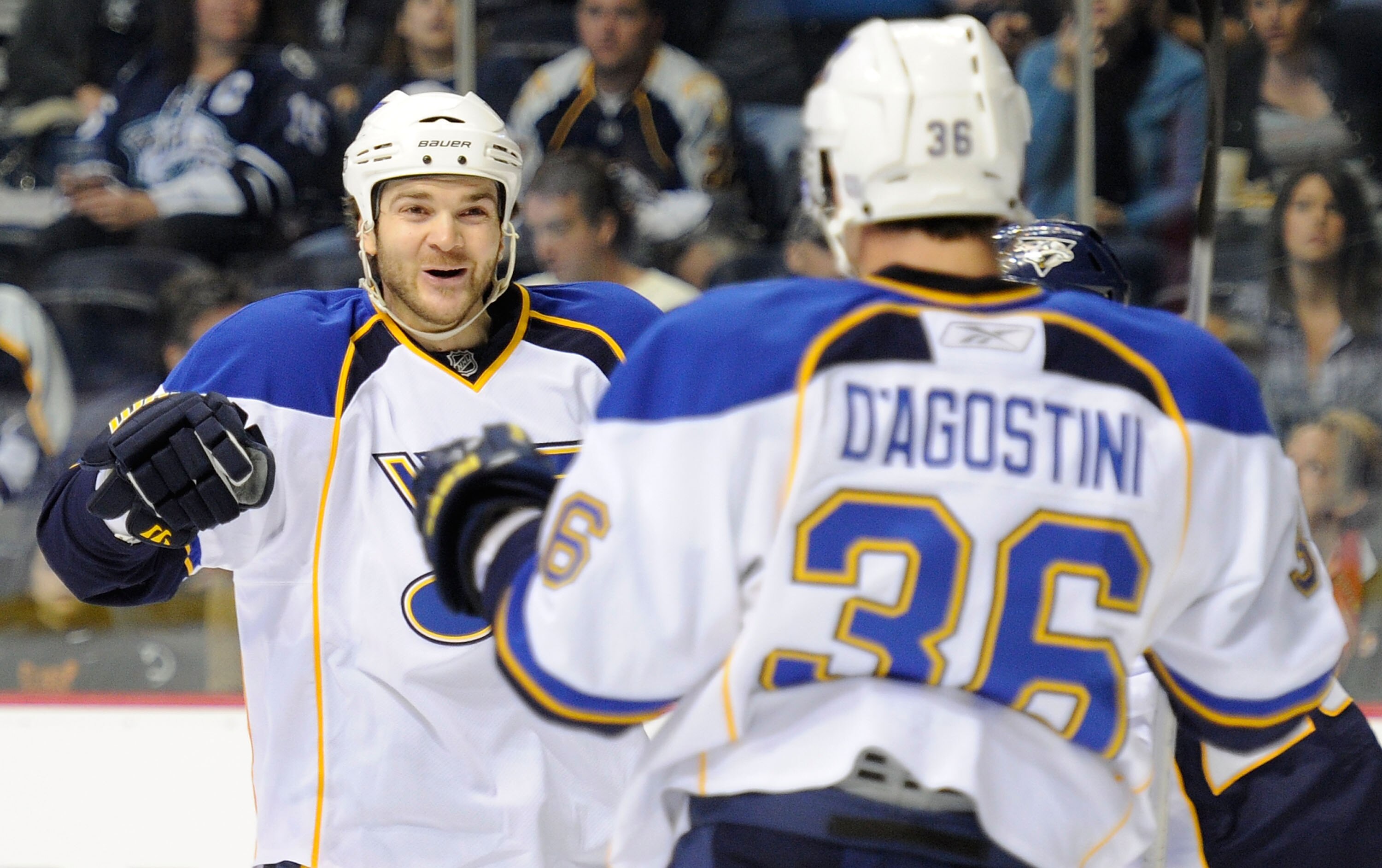NASHVILLE, TN - OCTOBER 14:   Defenseman Carlo Colaiacovo #28 and right wing Matt D'Agostino #36 of the St. Louis Blues celebrate after scoring a goal against the Nashville Predators on October 14, 2010 in Nashville, Tennessee.  (Photo by Frederick Breedo