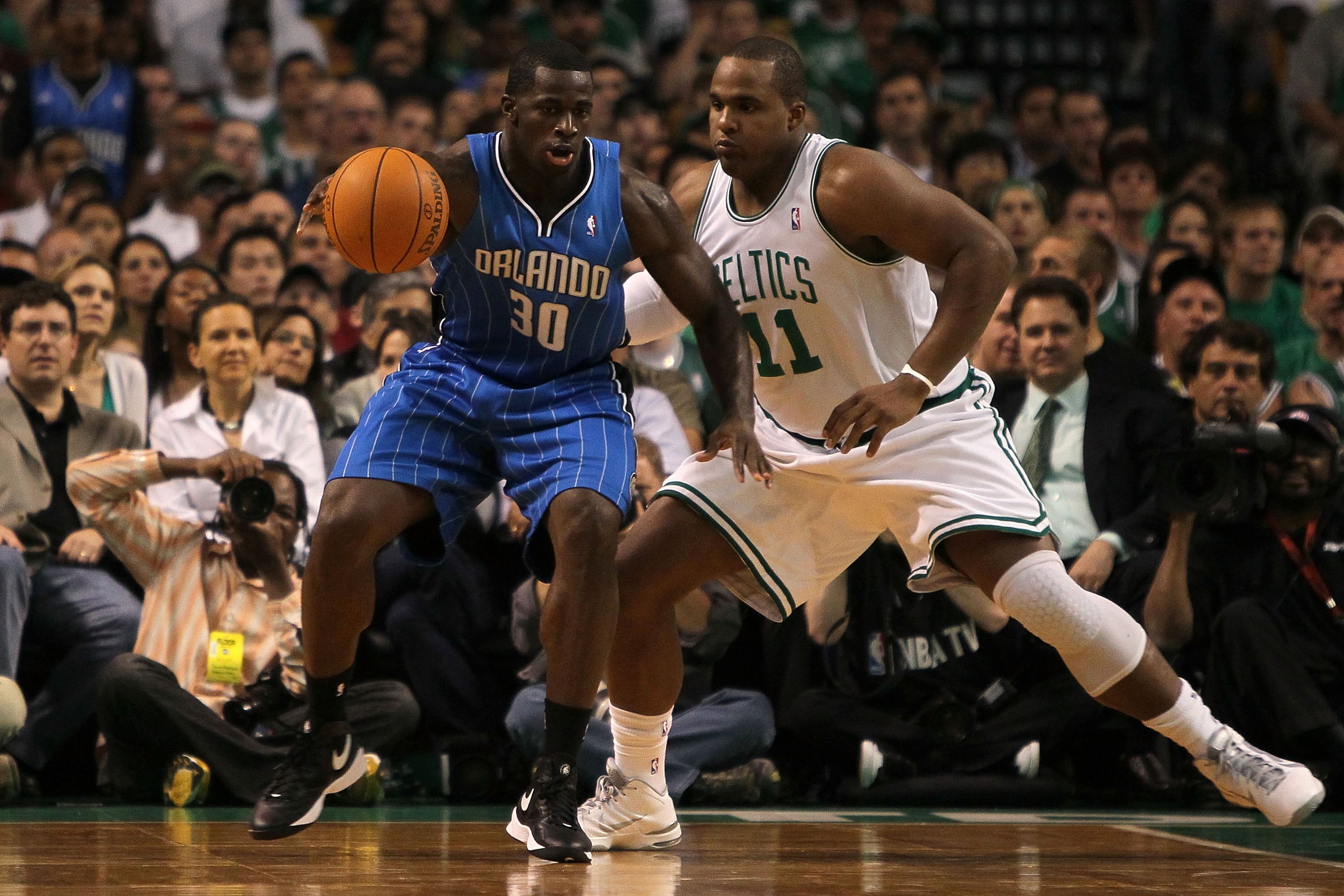BOSTON - MAY 24:  Brandon Bass #30 of the Orlando Magic moves the ball in the post against Glen Davis #11 of the Boston Celtics in Game Four of the Eastern Conference Finals during the 2010 NBA Playoffs at TD Banknorth Garden on May 24, 2010 in Boston, Ma