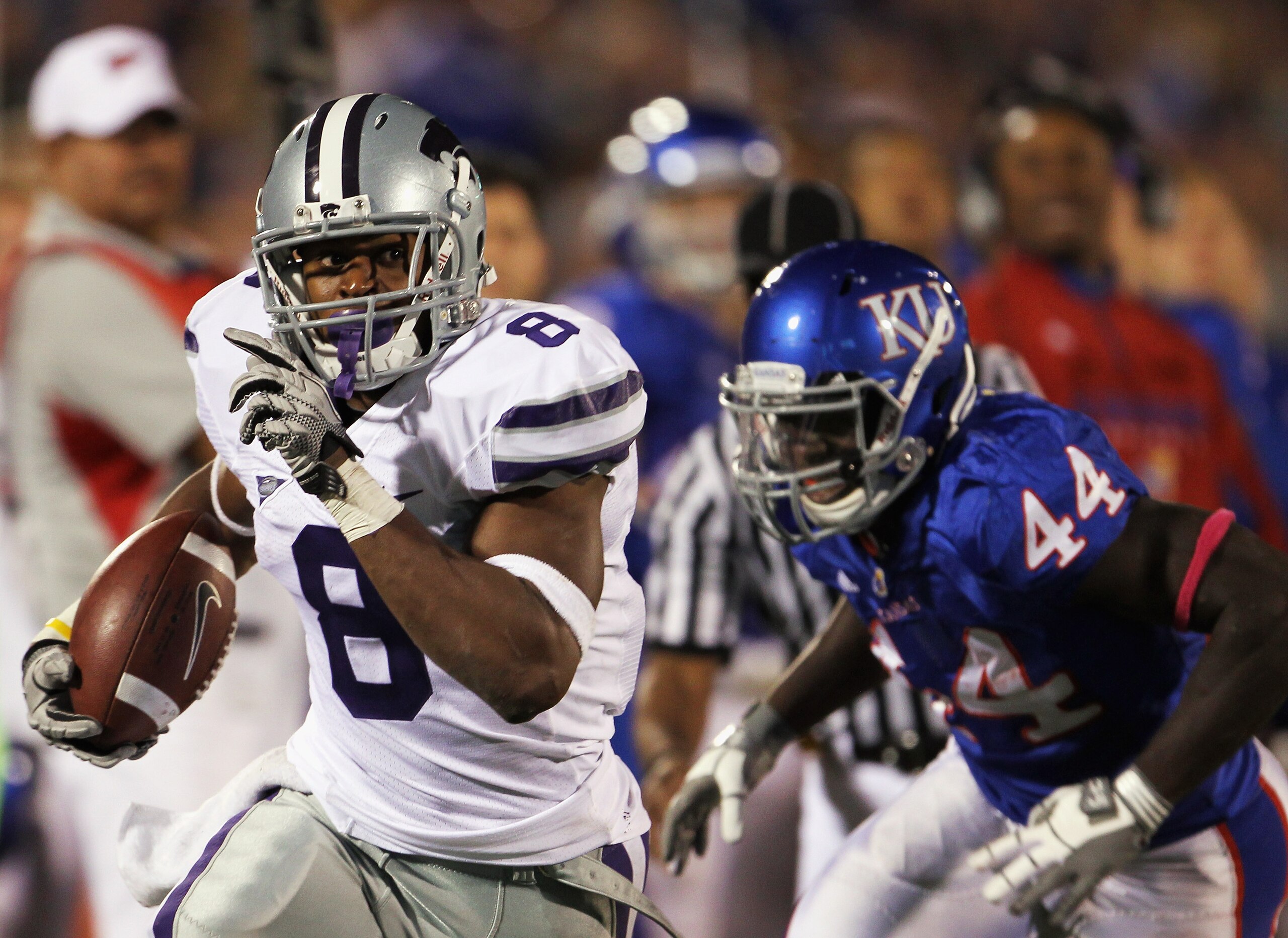 LAWRENCE, KS - OCTOBER 14:  Daniel Thomas #8 of the Kansas State Wildcats carries the ball as Olaitan Oguntodu #44 of the Kansas Jayhawks defends during the game on October 14, 2010 at Memorial Stadium in Lawrence, Kansas.  (Photo by Jamie Squire/Getty Im