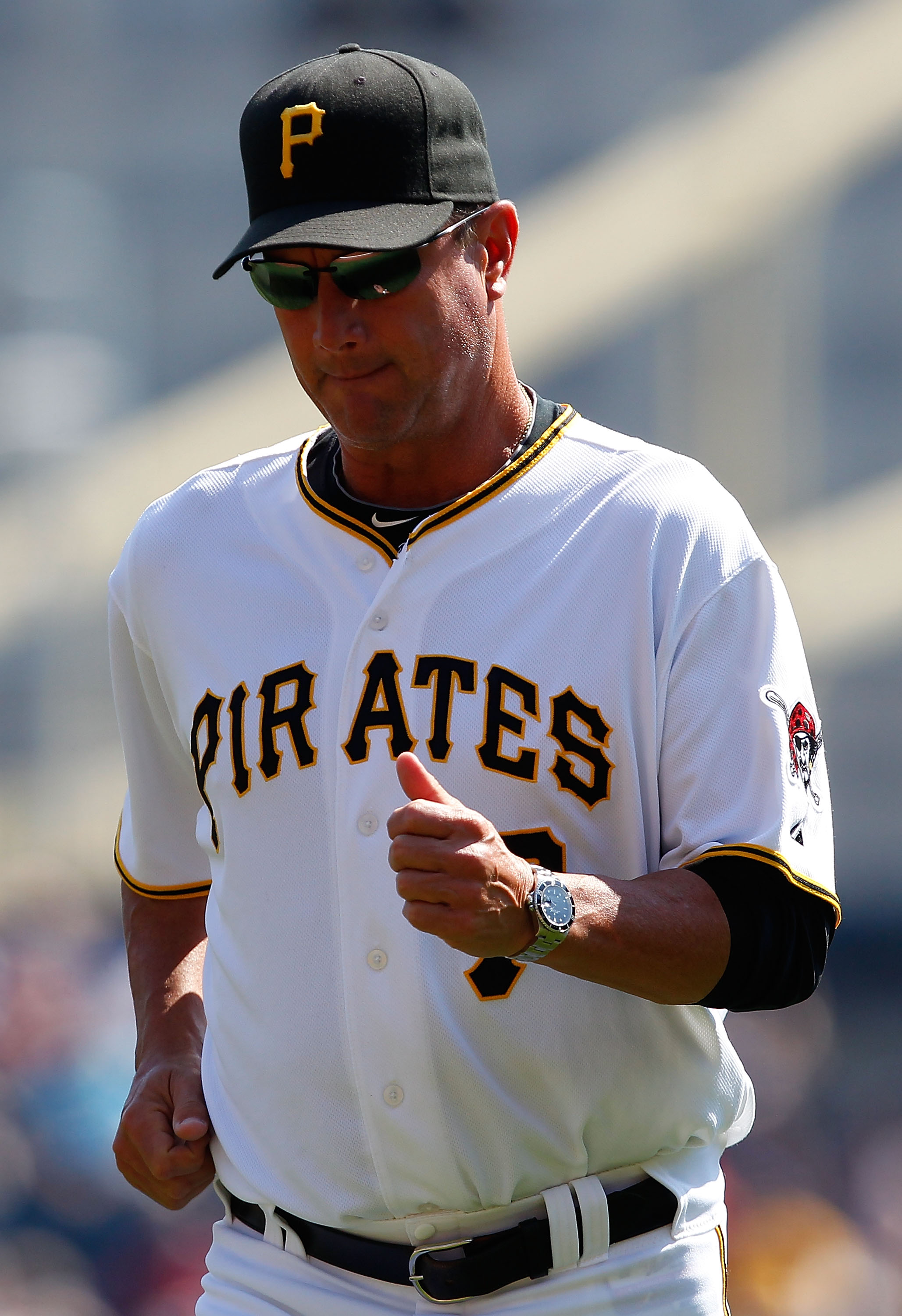 PITTSBURGH - SEPTEMBER 23:  Manager John Russell #7 of the Pittsburgh Pirates jobs back to the dugout after relieving Brian Burres #71 during the game against the St Louis Cardinals on September 23, 2010 at PNC Park in Pittsburgh, Pennsylvania.  (Photo by
