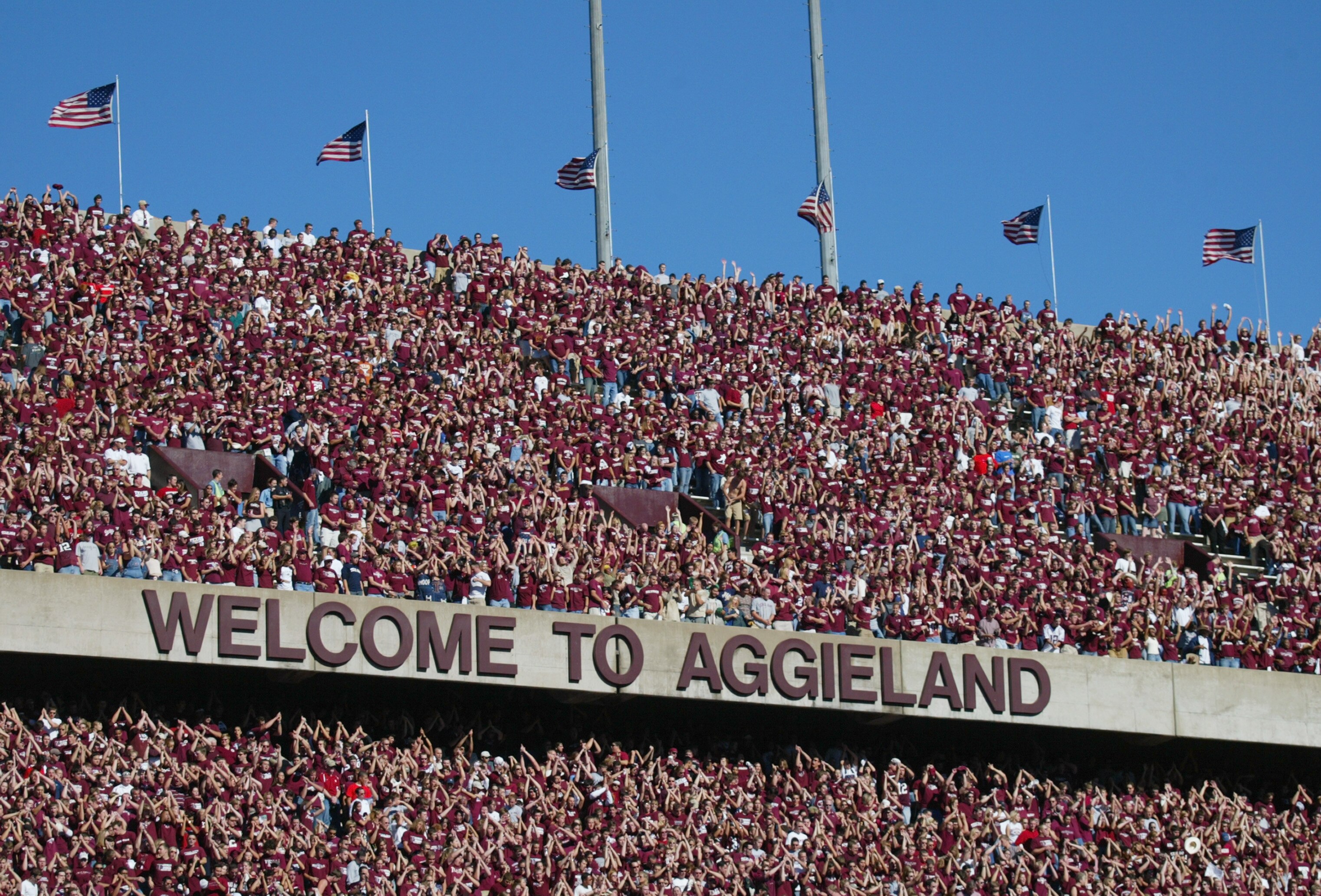 COLLEGE STATION, TX - NOVEMBER 6:  Texas A&M University Aggies fans, sometimes referred to as the 12th Man, watch the game against the University of Oklahoma Sooners on November 6, 2004 at Kyle Field in College Station, Texas. The Sooners defeated the Agg