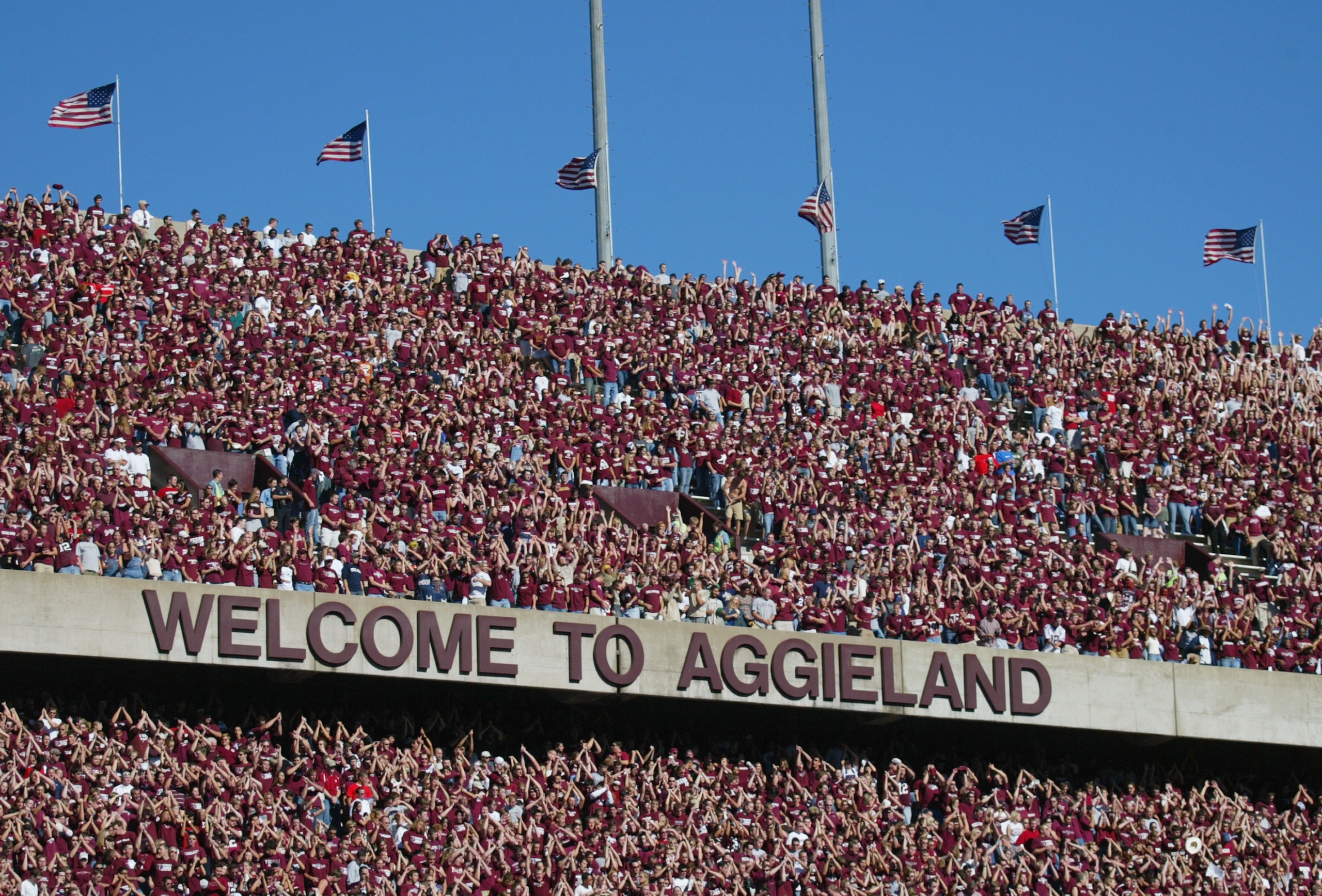 COLLEGE STATION, TX - NOVEMBER 6:  Texas A&M University Aggies fans, sometimes referred to as the 12th Man, watch the game against the University of Oklahoma Sooners on November 6, 2004 at Kyle Field in College Station, Texas. The Sooners defeated the Agg