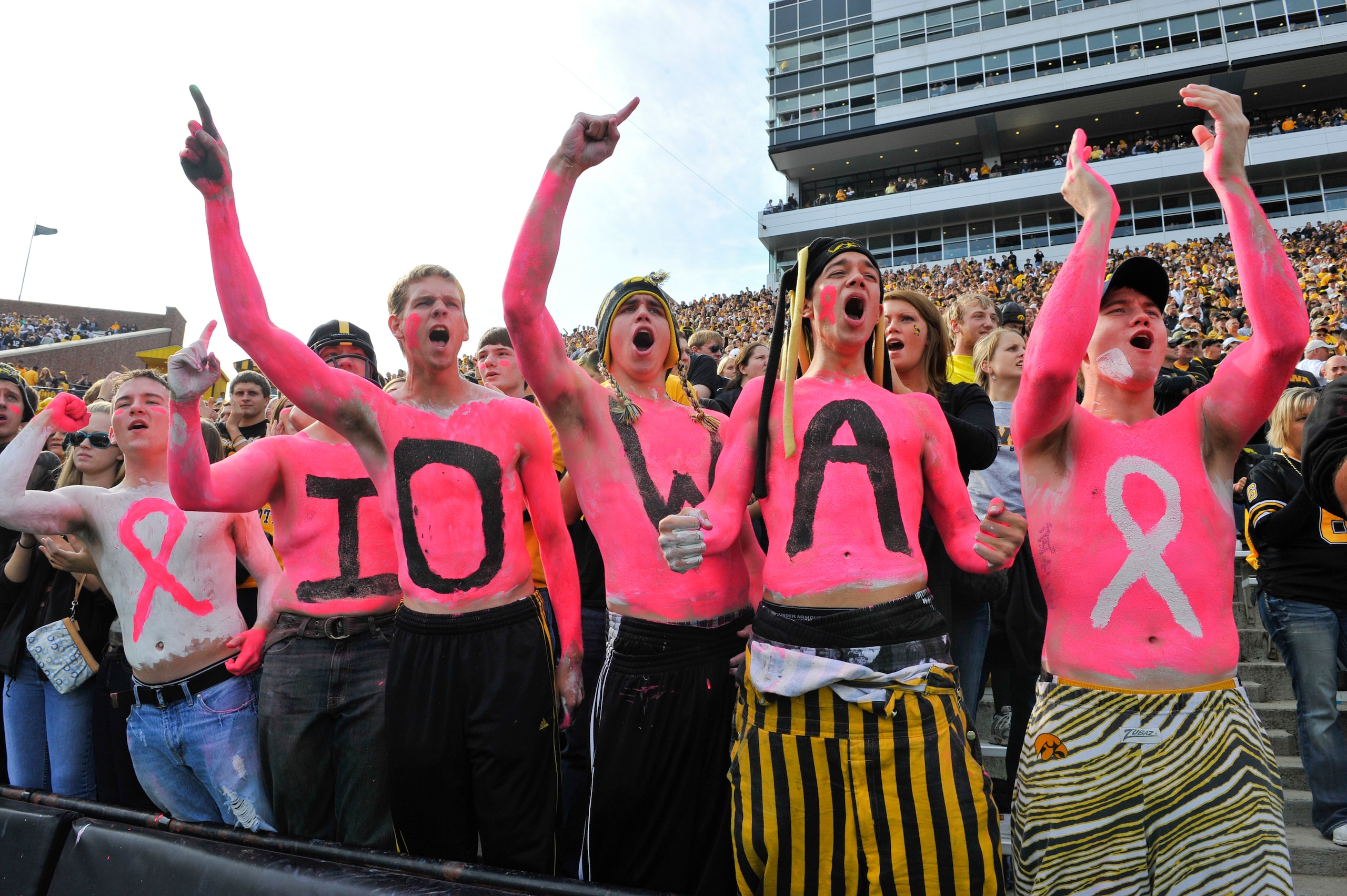 IOWA CITY, IA - OCTOBER 23: University of Iowa Hawkeyes fans cheer on their team as they take on the Wisconsin Badgers during the first half of play at Kinnick Stadium on October 23, 2010 in Iowa City, Iowa. Wisconsin won 31-30 over Iowa. (Photo by David 