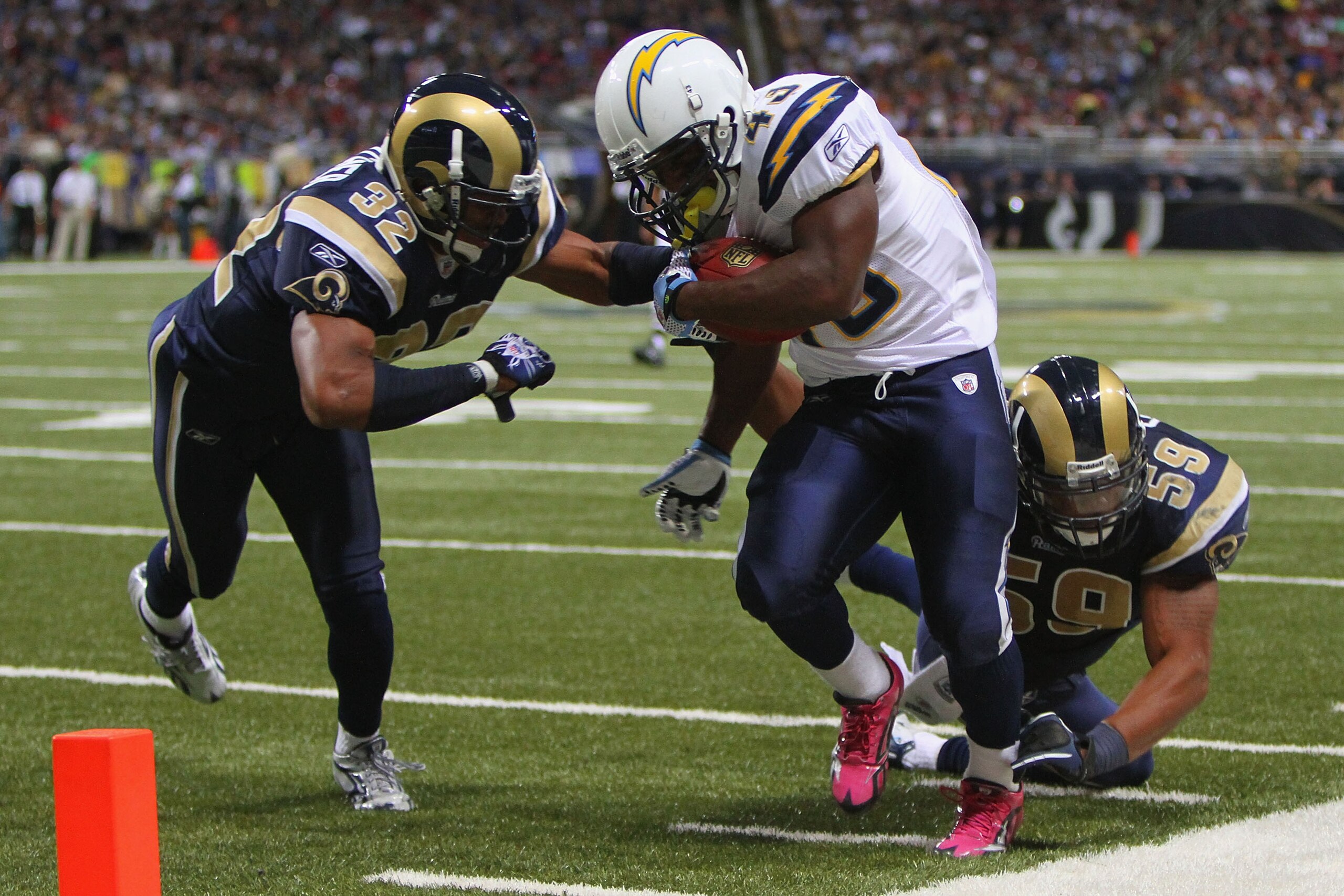 ST. LOUIS - OCTOBER 17: Darren Sproles #43 of the San Diego Chargers is pushed out of bounds by Bradley Fletcher #32 and Larry Grant #59 both of the St. Louis Rams at the Edward Jones Dome on October 17, 2010 in St. Louis, Missouri.  The Rams beat the Cha