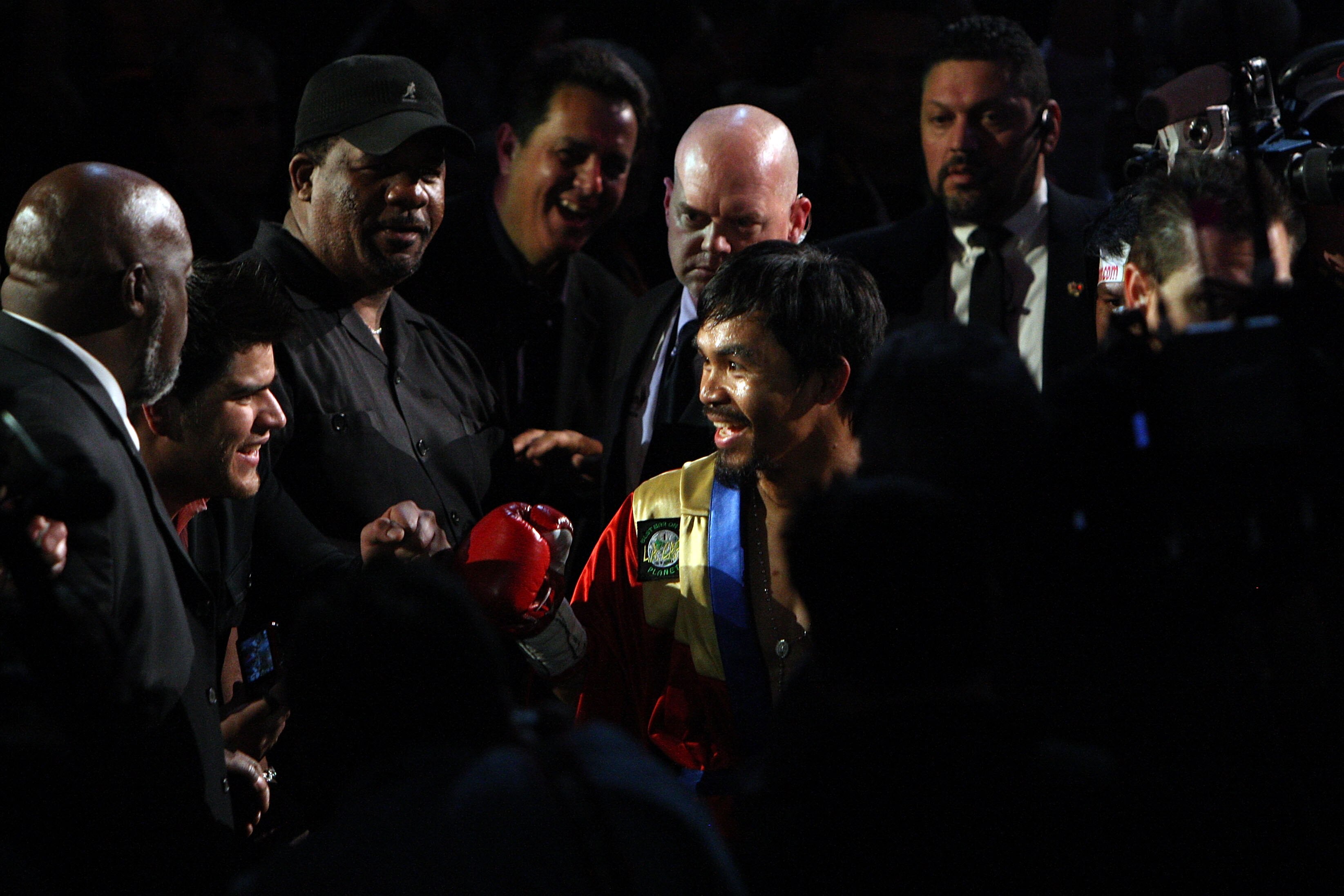 ARLINGTON, TX - MARCH 13:  Manny Pacquiao of the Philippines enters the ring before taking on Joshua Clottey of Ghana during the WBO welterweight title fight at Cowboys Stadium on March 13, 2010 in Arlington, Texas.  (Photo by Jed Jacobsohn/Getty Images)
