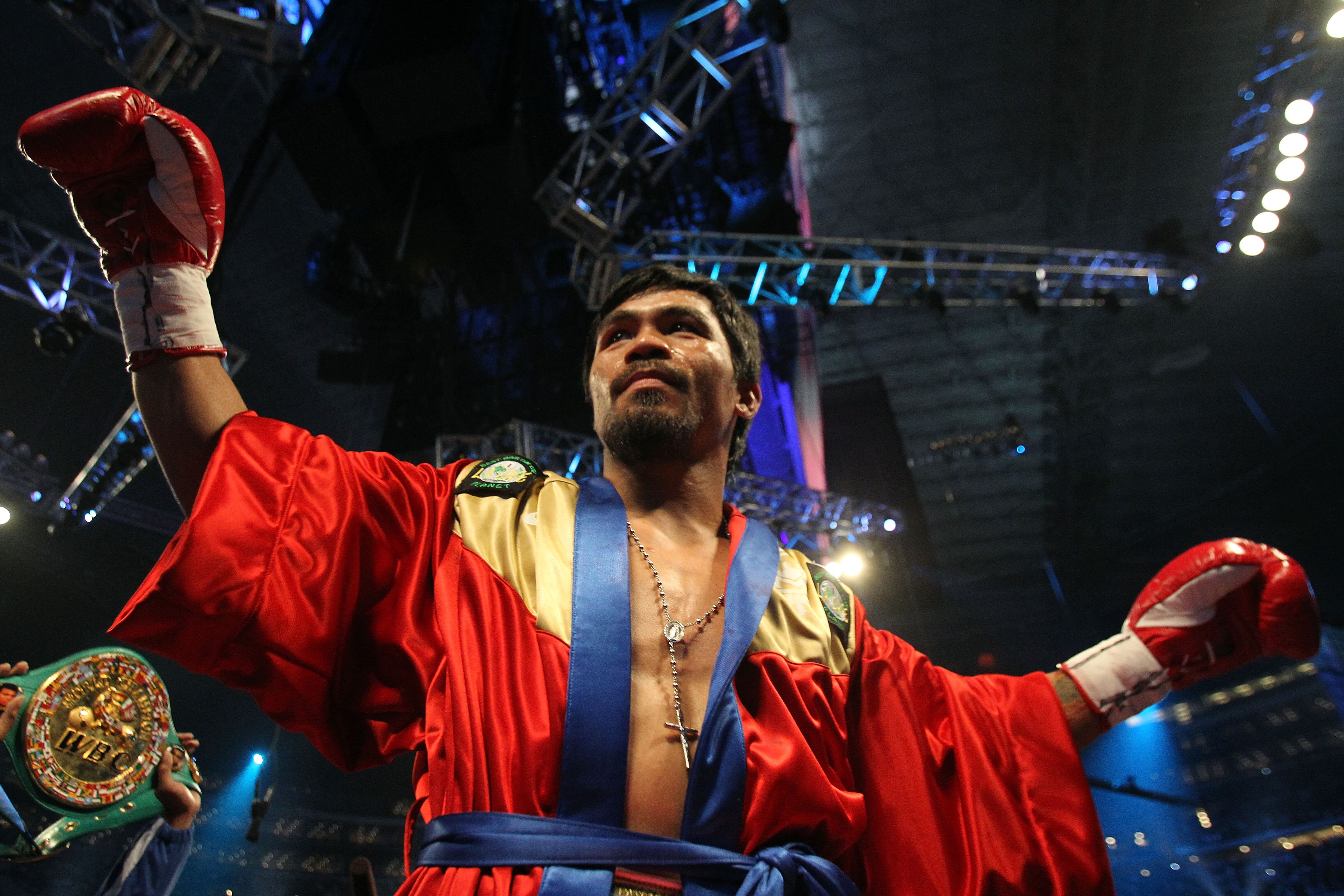 ARLINGTON, TX - MARCH 13:  Manny Pacquiao of the Philippines in the ring before taking on Joshua Clottey of Ghana during the WBO welterweight title fight at Cowboys Stadium on March 13, 2010 in Arlington, Texas.  (Photo by Jed Jacobsohn/Getty Images)