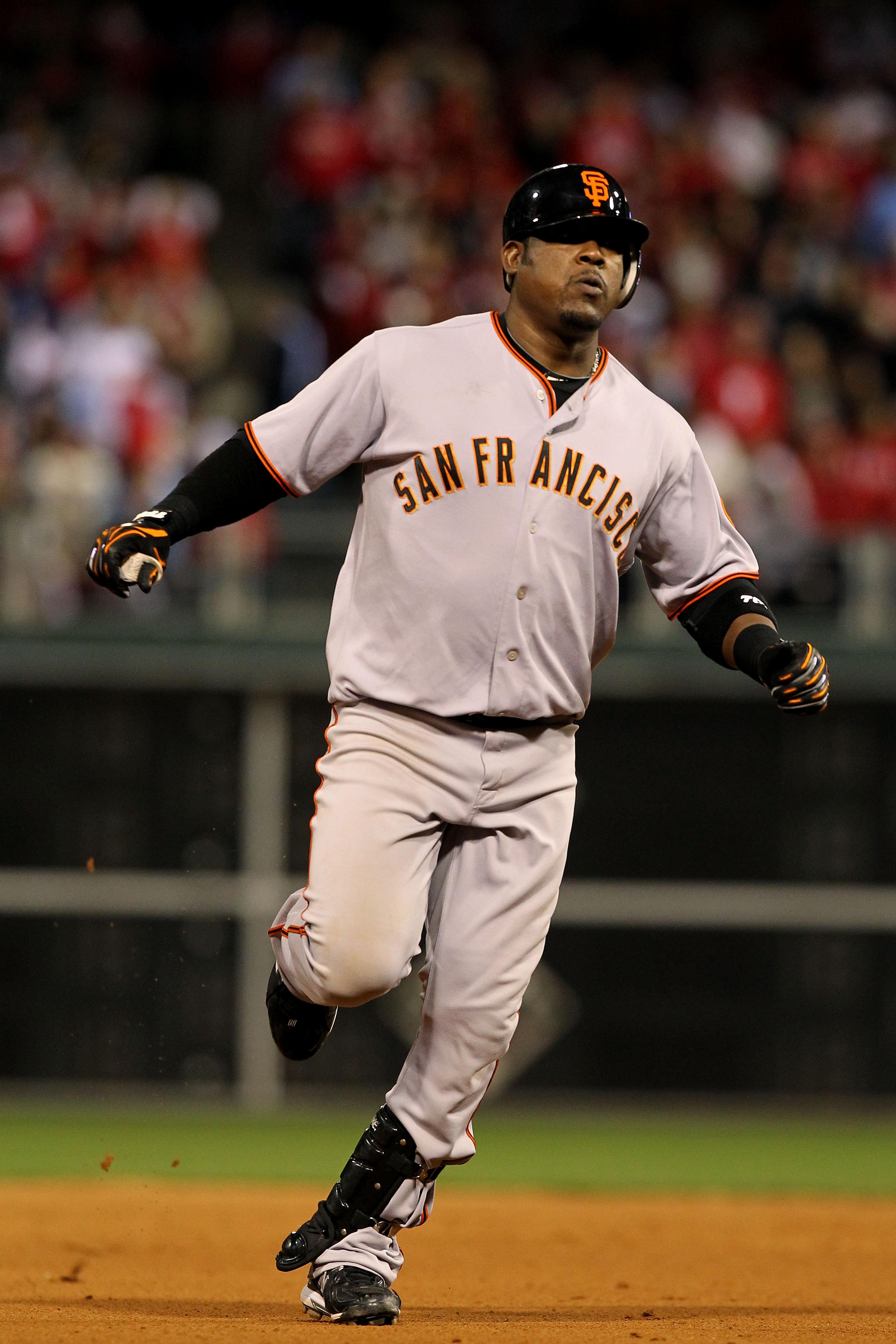 PHILADELPHIA - OCTOBER 23:  Juan Uribe #5 of the San Francisco Giants hits a solo home run to take a 3-2 lead in the eigth inning against the Philadelphia Phillies in Game Six of the NLCS during the 2010 MLB Playoffs at Citizens Bank Park on October 23, 2