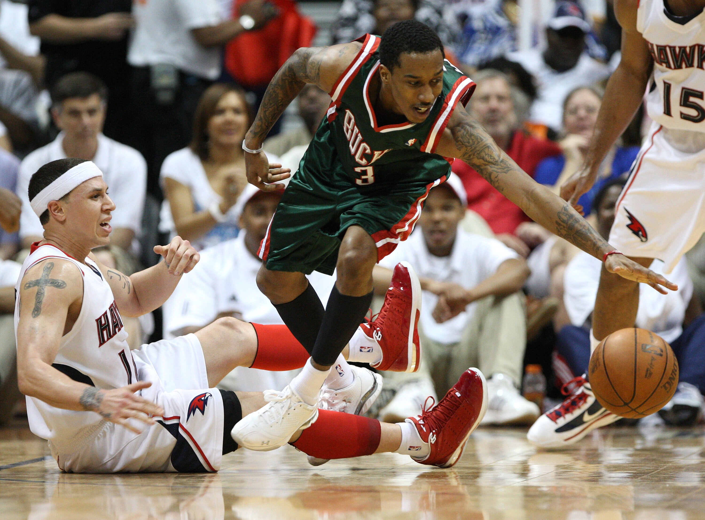 ATLANTA - MAY 2:  Guard Brandon Jennings #3 of the Milwaukee Bucks loses the ball while guard Mike Bibby #10 of the Atlanta Hawks defends him during Game Seven of the Eastern Conference Quarterfinals during the 2010 NBA Playoffs at Philips Arena on May 2,