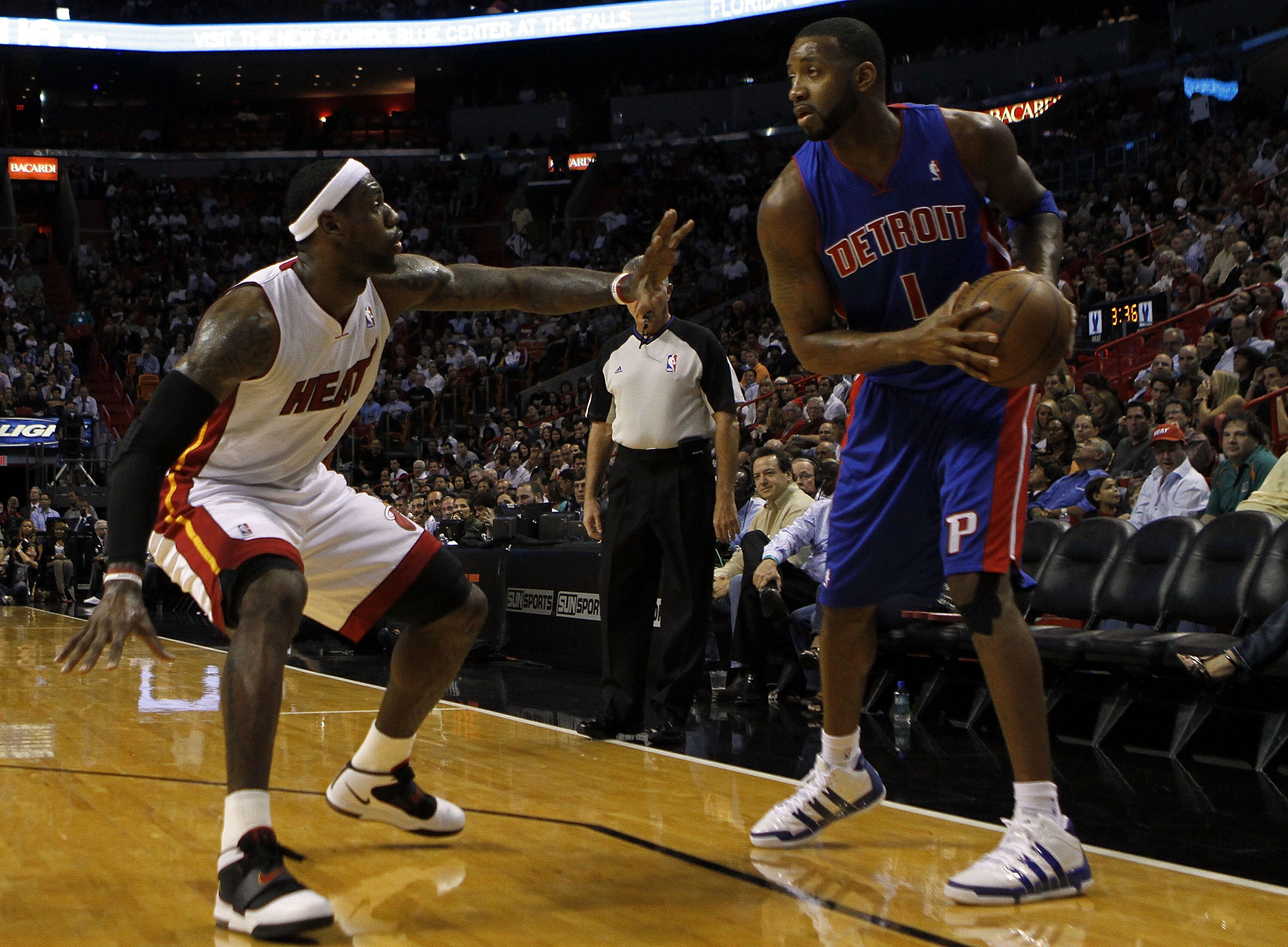 MIAMI - OCTOBER 05:  Forward LeBron James #6 of the Miami Heat takes on giard Tracy McGrady #1of the Detroit Pistons on October 5, 2010 in Miami, Florida.  NOTE TO USER: User expressly acknowledges and agrees that, by downloading and or using this photogr