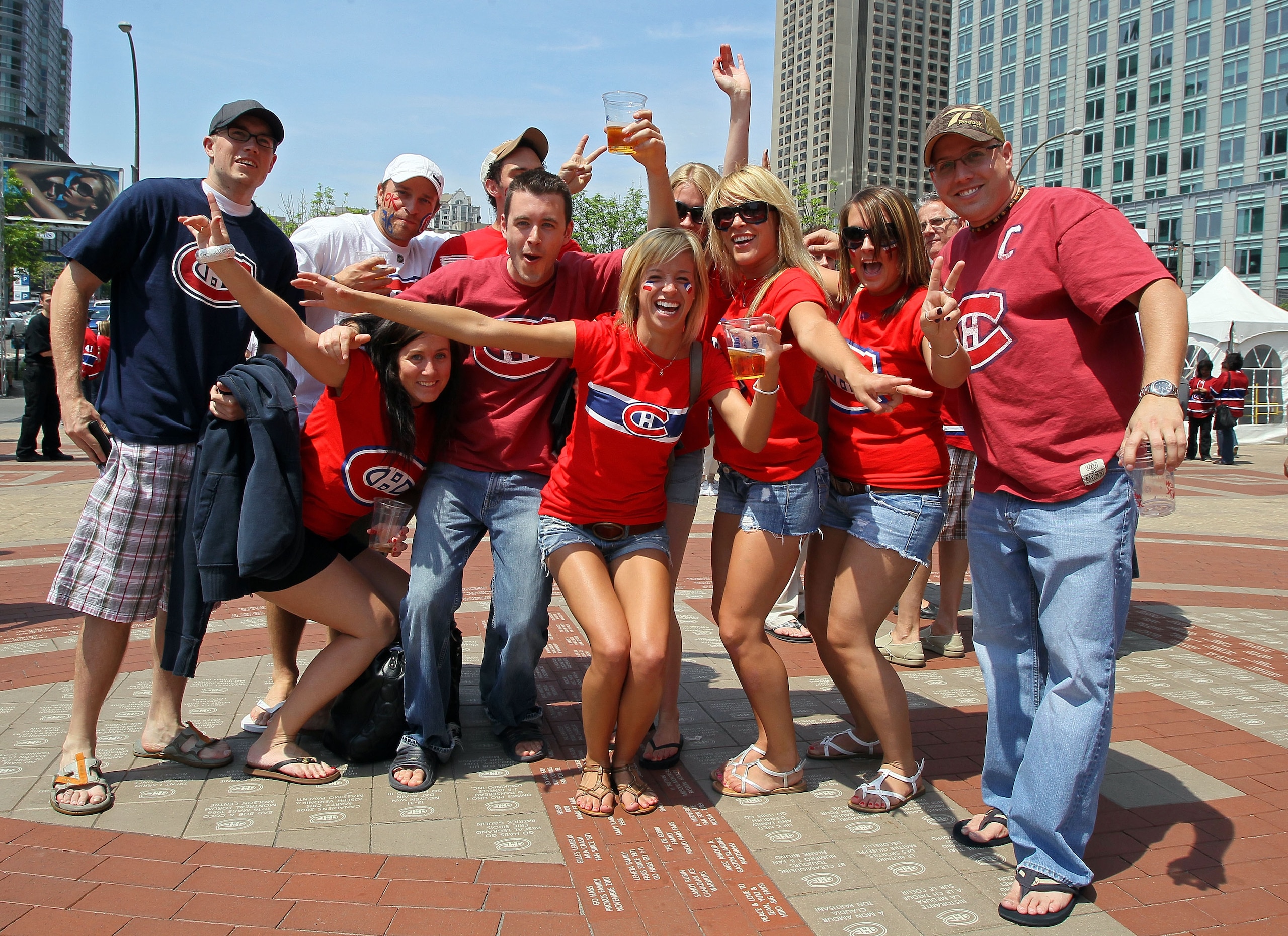MONTREAL, QC - MAY 22:  Fans of the Montreal Canadiens pose outside prior to the start of Game 4 of the Eastern Conference Finals during the 2010 NHL Stanley Cup Playoffs at Bell Centre on May 22, 2010 in Montreal, Canada.  (Photo by Jim McIsaac/Getty Ima
