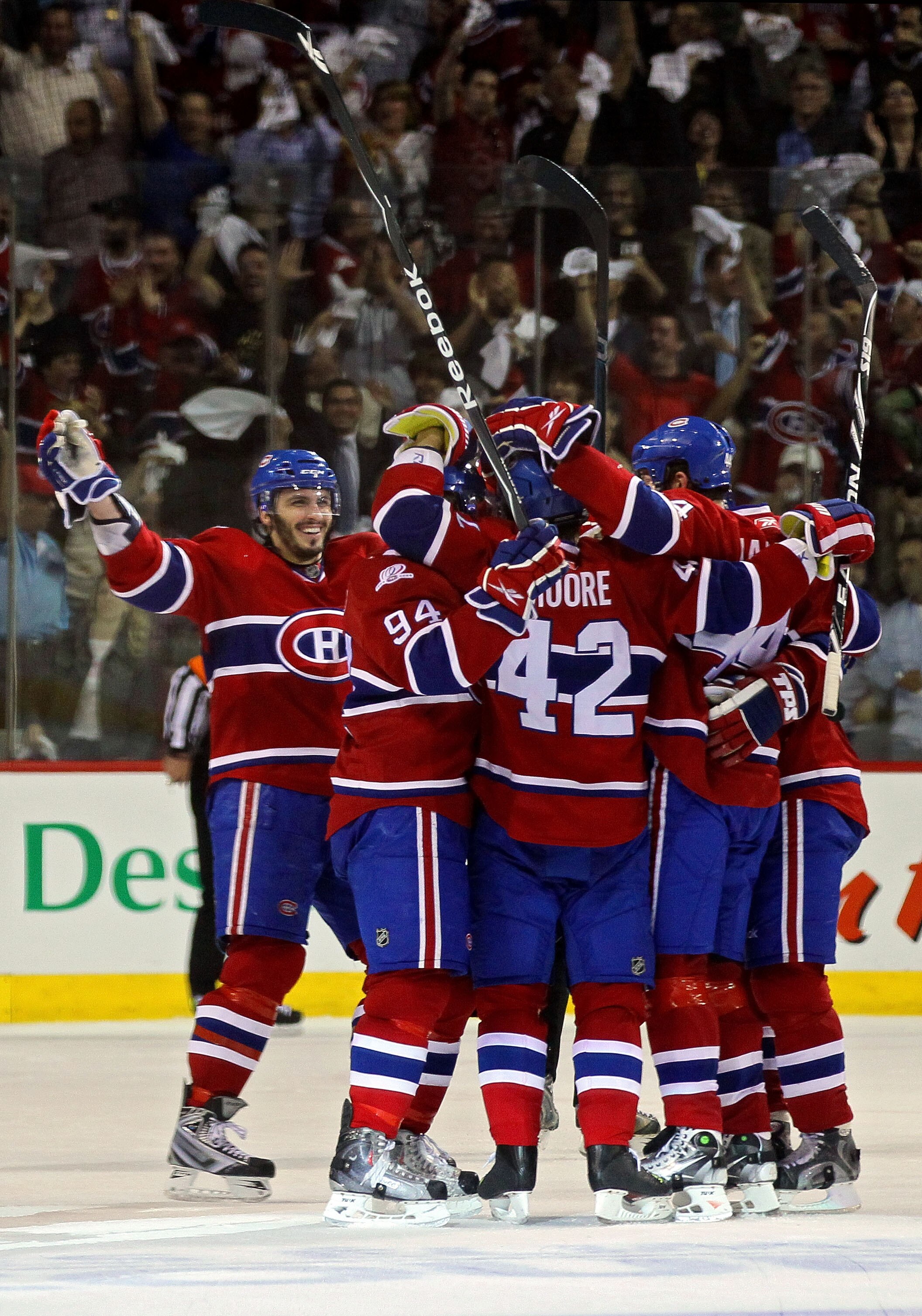 MONTREAL, QC - MAY 20:  Dominic Moore #42 of the Montreal Canadiens celebrates with his team after scoring a goal against the Philadelphia Flyers second period of Game 3 of the Eastern Conference Finals during the 2010 NHL Stanley Cup Playoffs at Bell Cen