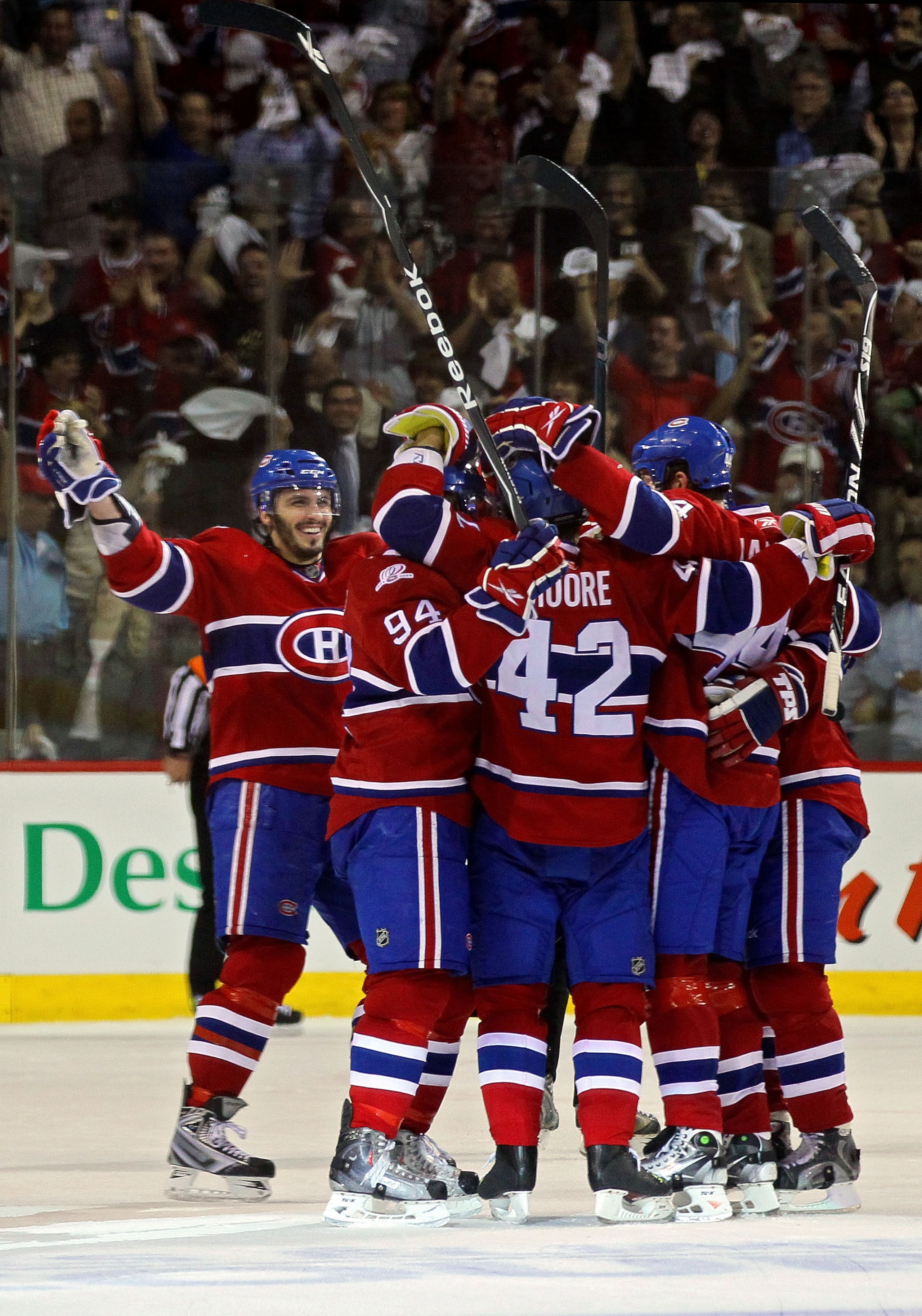 MONTREAL, QC - MAY 20:  Dominic Moore #42 of the Montreal Canadiens celebrates with his team after scoring a goal against the Philadelphia Flyers second period of Game 3 of the Eastern Conference Finals during the 2010 NHL Stanley Cup Playoffs at Bell Cen