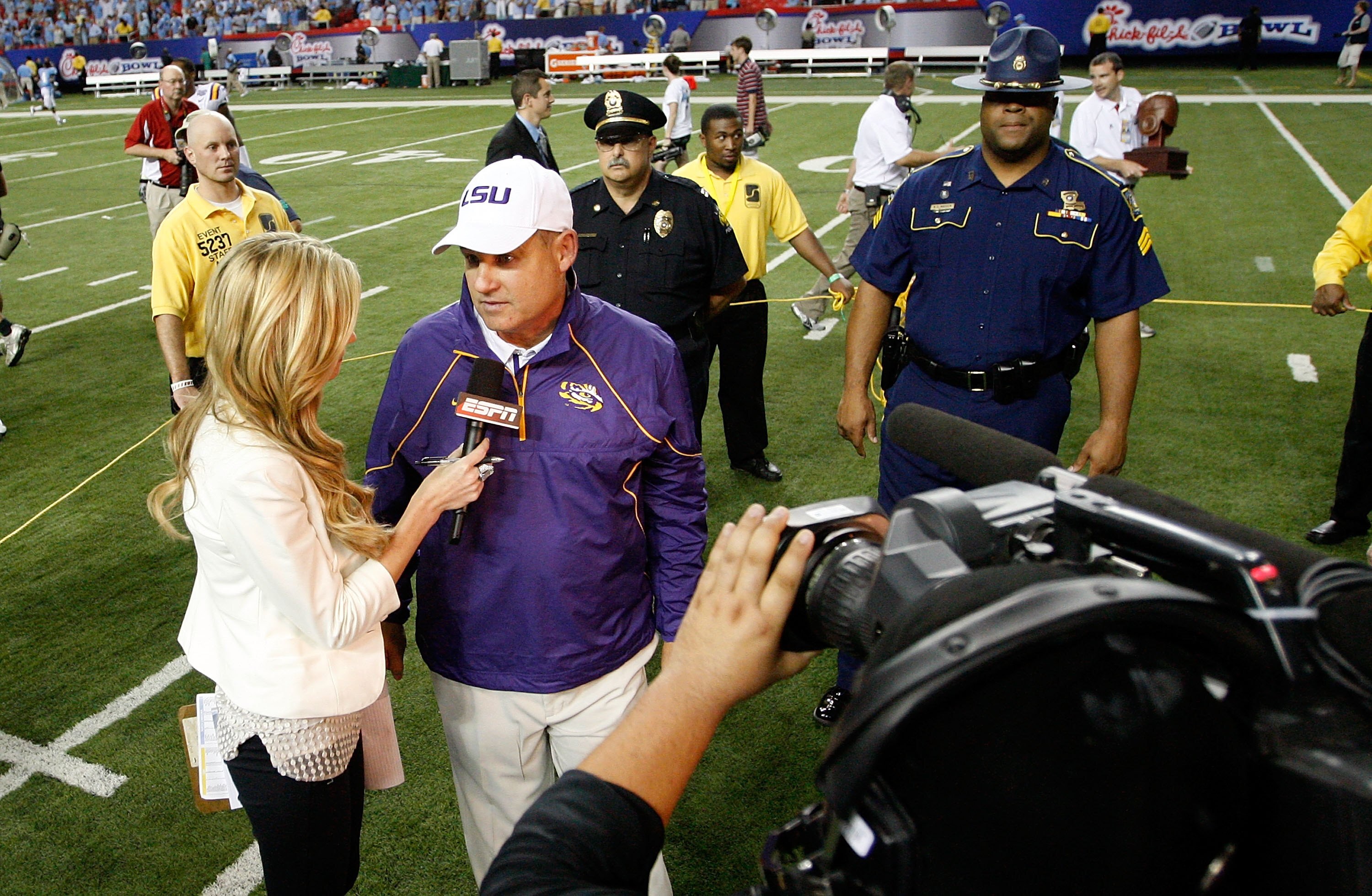 ATLANTA - SEPTEMBER 04:  Head coach Les Miles of the LSU Tigers is interviewed by Erin Andrews after their 30-24 win over the North Carolina Tar Heels during the Chick-fil-A Kickoff Game at Georgia Dome on September 4, 2010 in Atlanta, Georgia.  (Photo by