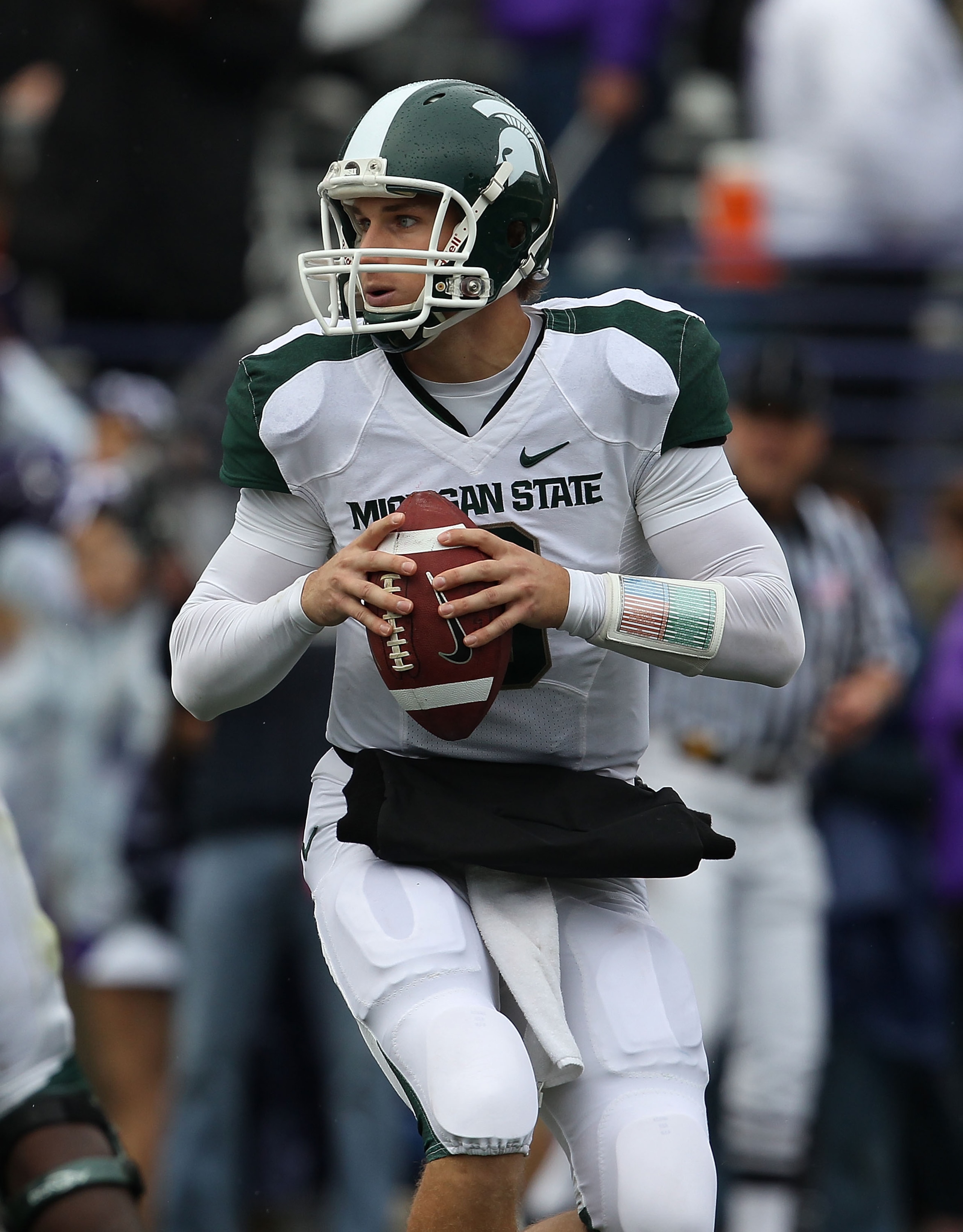 EVANSTON, IL - OCTOBER 23: Kirk Cousins #8 of the Michigan State Spartans rolls out to look for receiver against the Northwestern Wildcats at Ryan Field on October 23, 2010 in Evanston, Illinois. Michigan State defeated Northwestern 35-27. (Photo by Jonat EVANSTON, IL - OCTOBER 23: Kirk Cousins #8 of the Michigan State Spartans rolls out to look for receiver against the Northwestern Wildcats at Ryan Field on October 23, 2010 in Evanston, Illinois. Michigan State defeated Northwestern 35-27. (Photo by Jonat