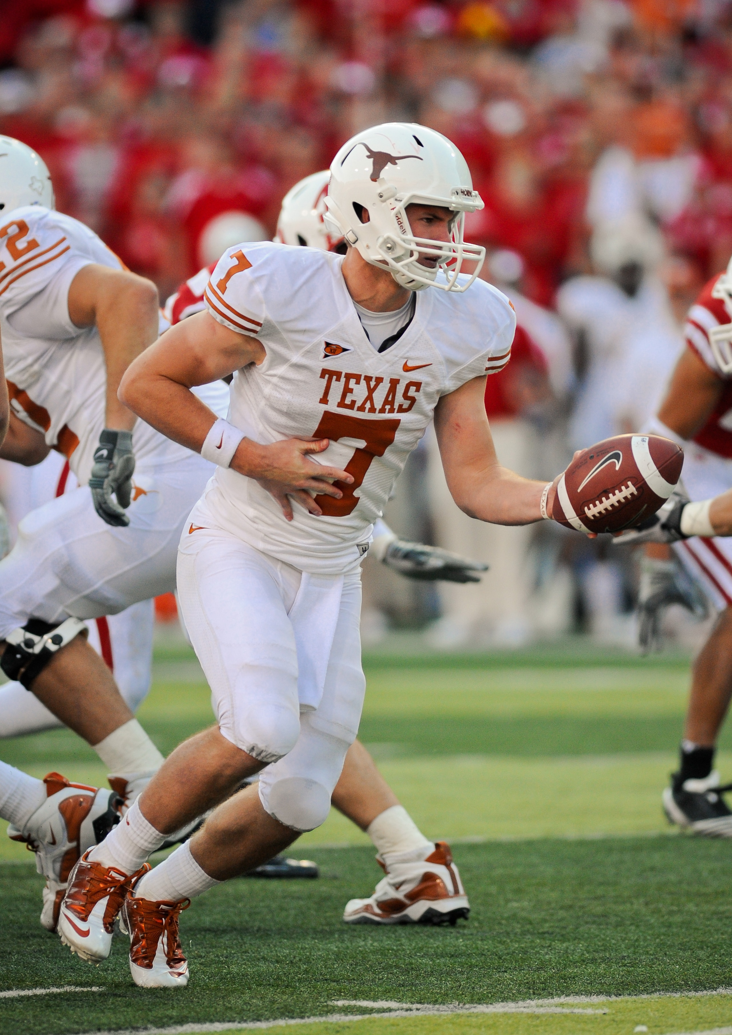 LINCOLN, NE - OCTOBER 16: Quarterback Garrett Gilbert #7 of the Texas Longhorns prepares to hand the ball off during their game at Memorial Stadium on October 16, 2010 in Lincoln, Nebraska. Texas Defeated Nebraska 20-13. (Photo by Eric Francis/Getty Image LINCOLN, NE - OCTOBER 16: Quarterback Garrett Gilbert #7 of the Texas Longhorns prepares to hand the ball off during their game at Memorial Stadium on October 16, 2010 in Lincoln, Nebraska. Texas Defeated Nebraska 20-13. (Photo by Eric Francis/Getty Image