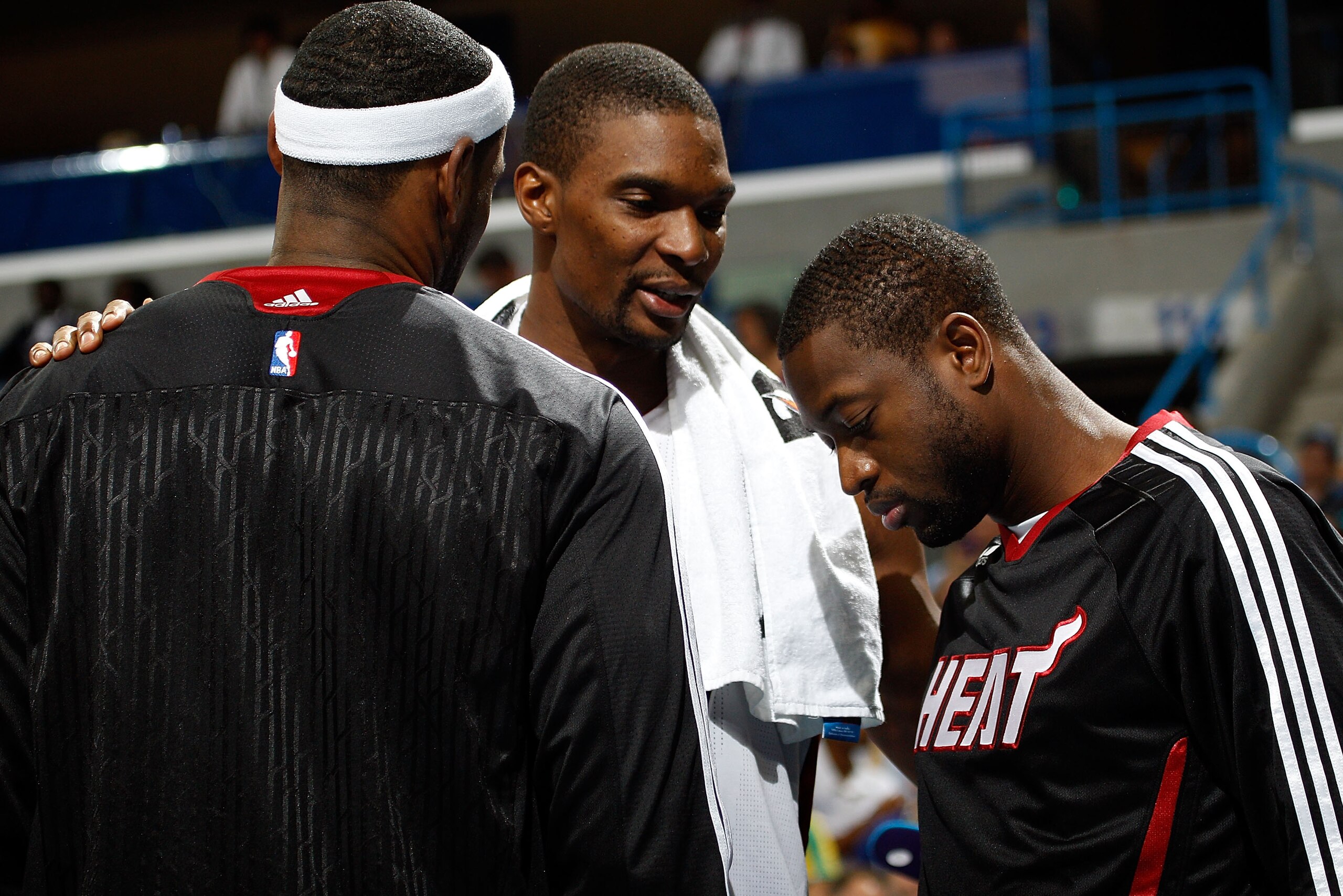 NEW ORLEANS - OCTOBER 13:  Chris Bosh #1 talks with LeBron James #6 and Dwyane Wade #3 of the Miami Heat during a time out against  the New Orleans Hornets at the New Orleans Arena on October 13, 2010 in New Orleans, Louisiana.  NOTE TO USER: User express