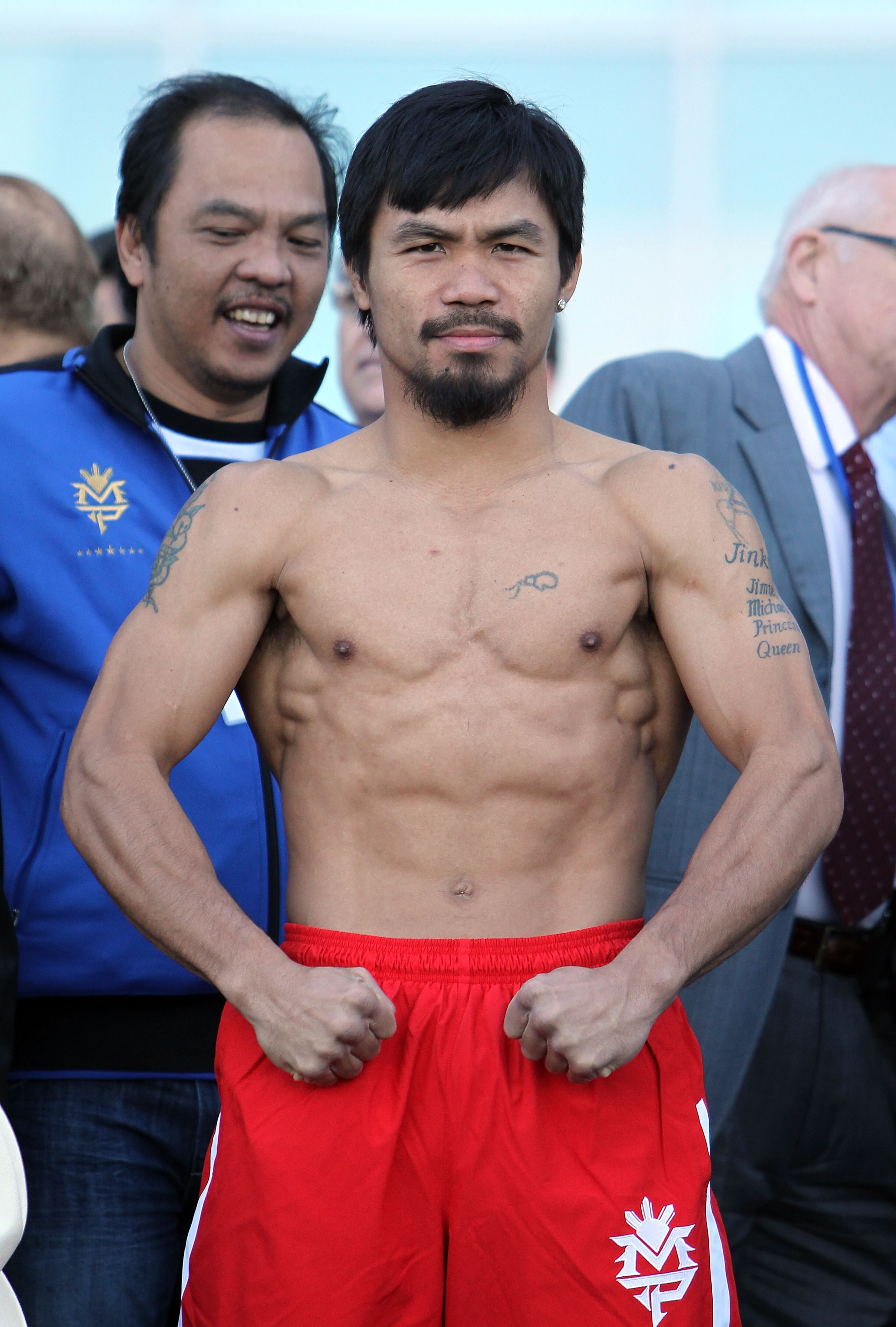 ARLINGTON, TX - MARCH 12:  Manny Pacquiao of the Philippines poses after he steps on the scale during the weigh-in for his WBO welterweight title fight against Joshua Clottey of Ghana outside Cowboys Stadium on March 12, 2010 in Arlington, Texas. Pacquiao