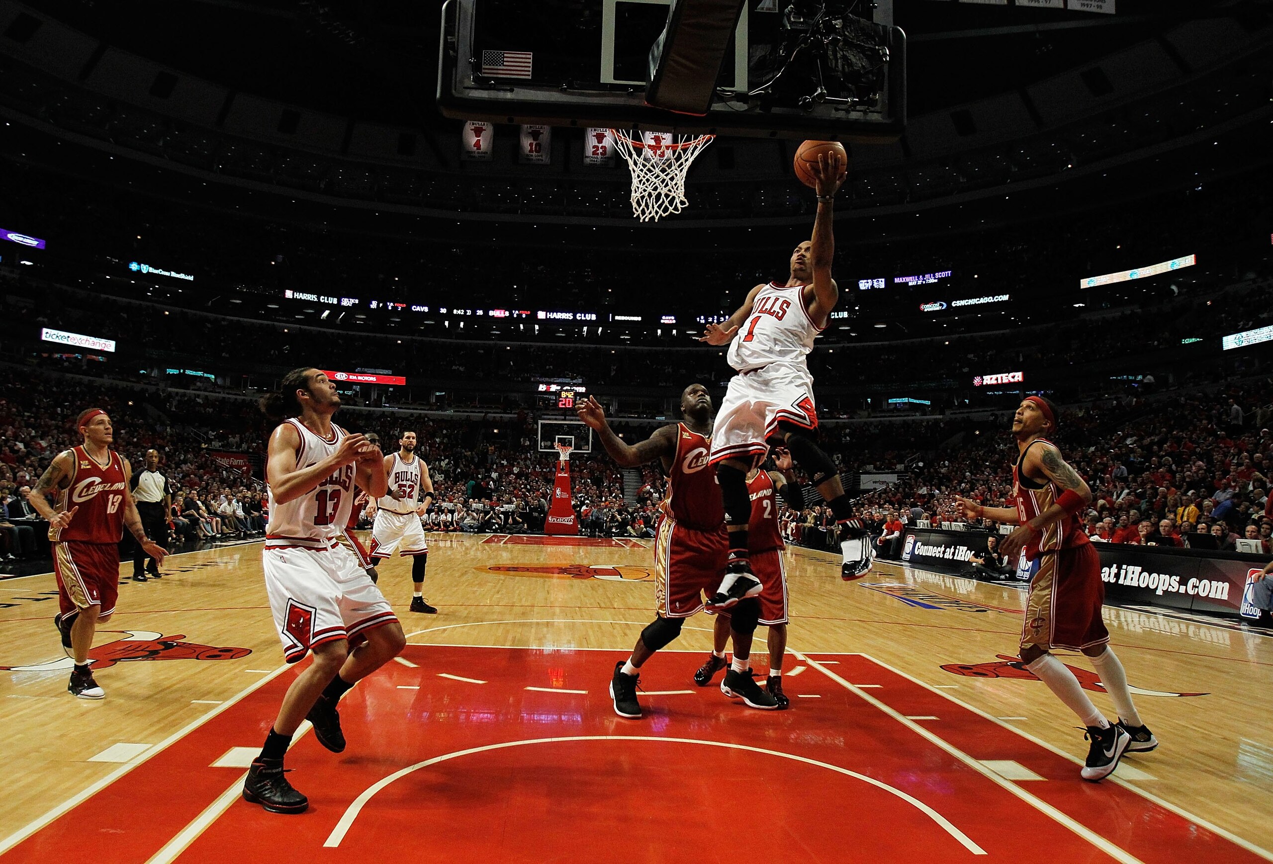 CHICAGO - APRIL 25: Derrick Rose #1 of the Chicago Bulls drives to the basket over Shaquille O'Neal #33 of the Cleveland Cavaliers in Game Four of the Eastern Conference Quarterfinals during the 2010 NBA Playoffs at the United Center on April 25, 2010 in