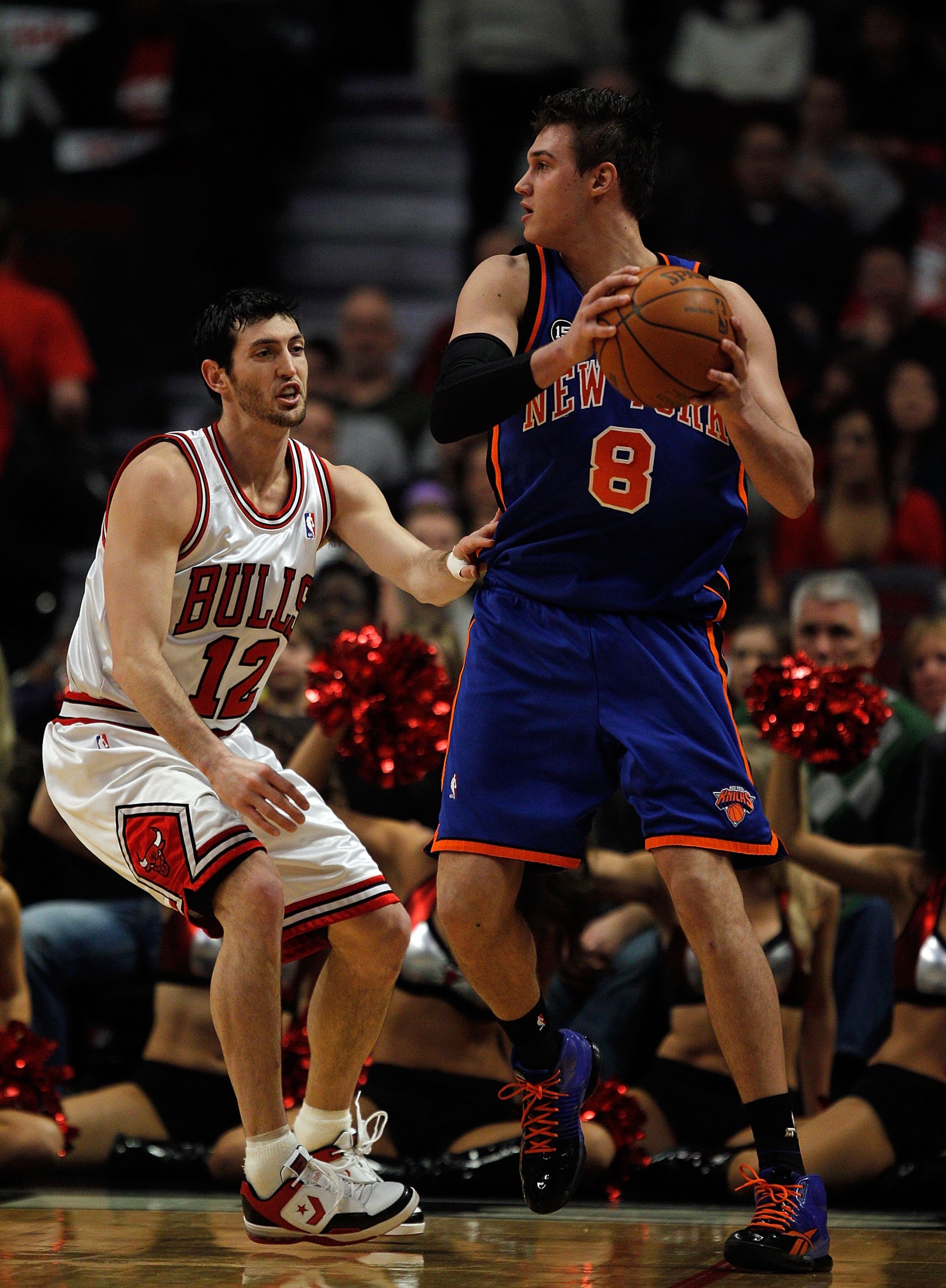 CHICAGO - FEBRUARY 16: Danilo Gallinari #8 of the New York Knicks looks to pass as Kirk Hinrich #12 of the Chicago Bulls defends at the United Center on February 16, 2010 in Chicago, Illinois. The Bulls defeated the Knicks 118-85. NOTE TO USER: User expre