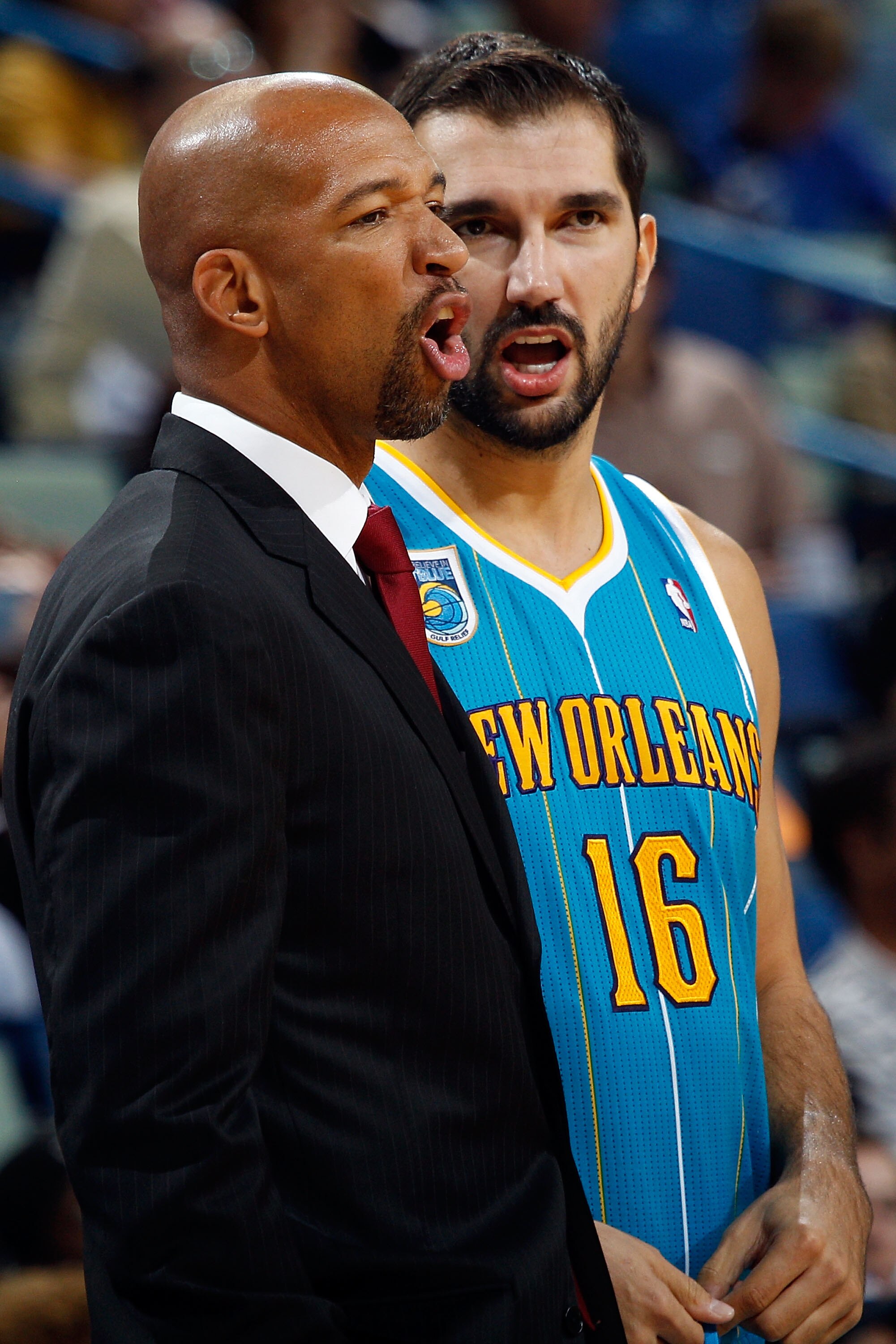 NEW ORLEANS - OCTOBER 13:  Head coach Monty Williams and Peja Stojakovic #16 of the New Orleans Hornets in action during the game against the Miami Heat at the New Orleans Arena on October 13, 2010 in New Orleans, Louisiana.  NOTE TO USER: User expressly