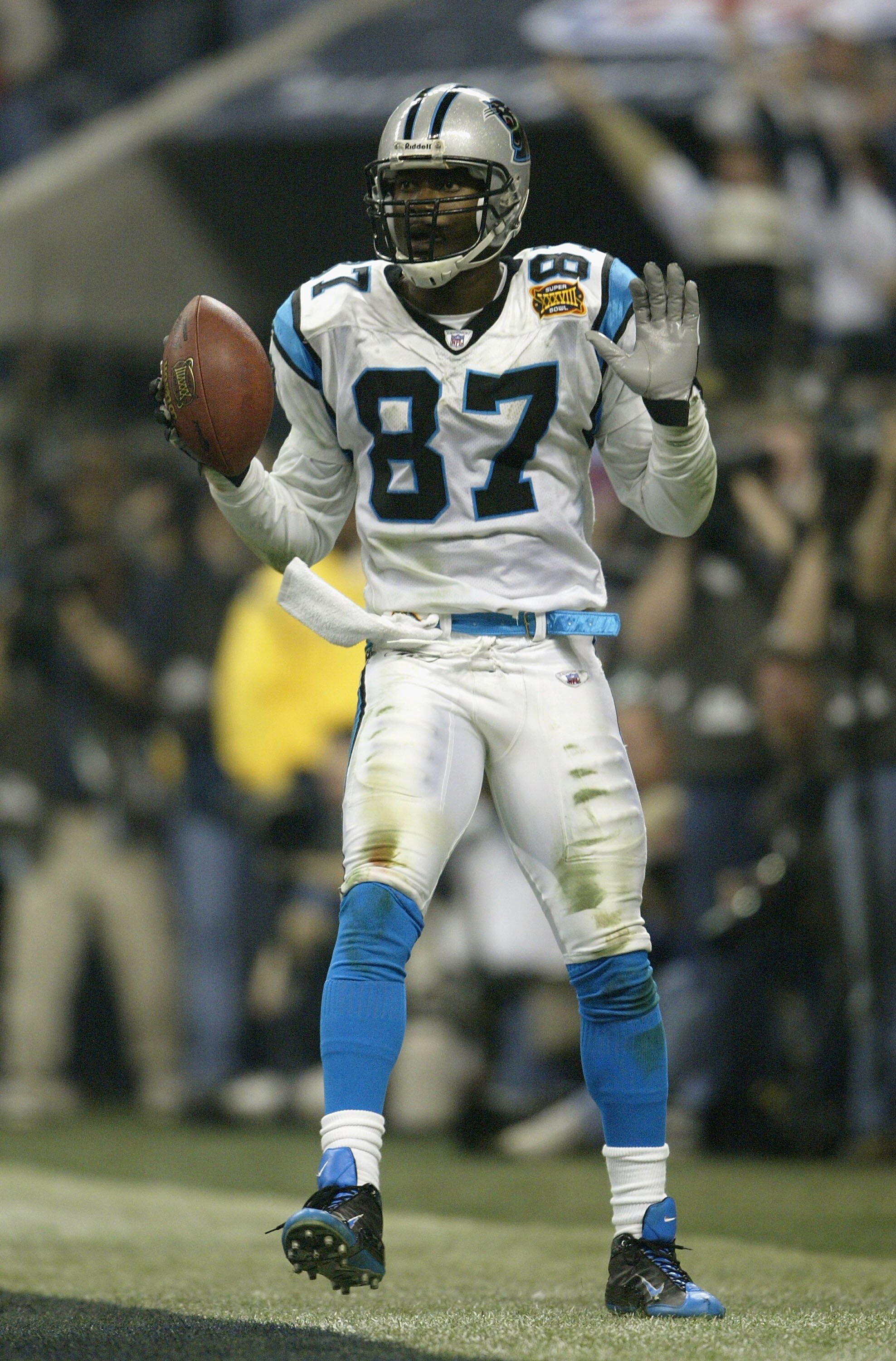 HOUSTON, TX - FEBRUARY 1:  Wide receiver Muhsin Muhammad #87 of the Carolina Panthers celebrates his 85 yard touchdown against the New England Patriots during the fourth quarter of Super Bowl XXXVIII at Reliant Stadium on February 1, 2004 in Houston, Texa