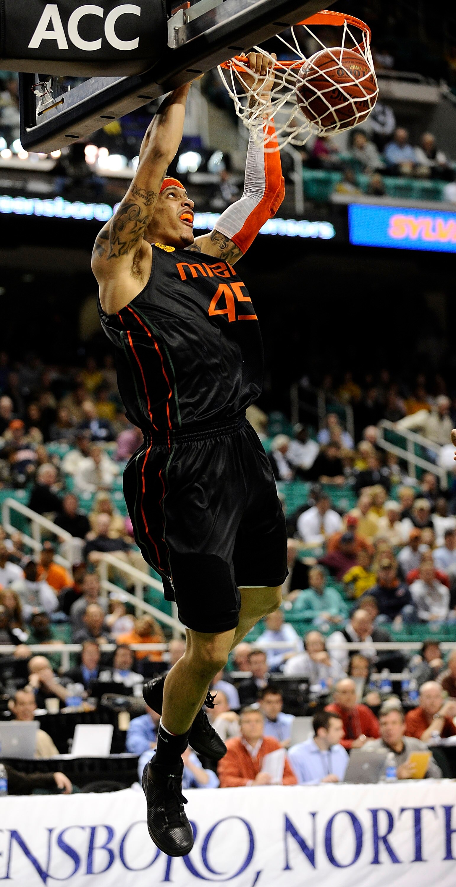 GREENSBORO, NC - MARCH 11:  Julian Gamble #45 of the University of Miami Hurricanes dunks against the Wake Forest Demon Deacons in their first round game in the 2010 ACC Men's Basketball Tournament at the Greensboro Coliseum on March 11, 2010 in Greensbor