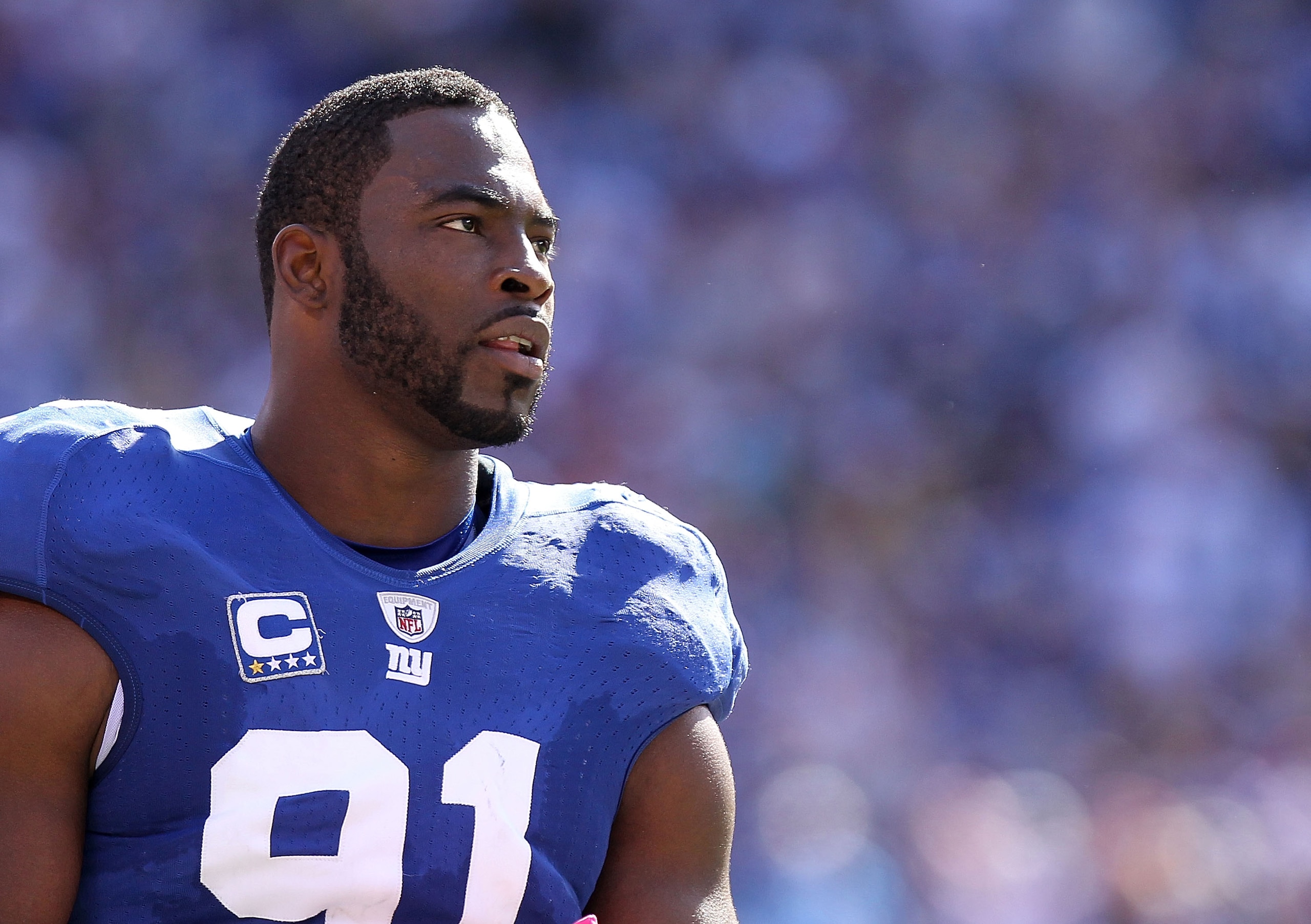 EAST RUTHERFORD, NJ - OCTOBER 17:  Justin Tuck #91  of the New York Giants against the Detroit Lions at New Meadowlands Stadium on October 17, 2010 in East Rutherford, New Jersey.  (Photo by Nick Laham/Getty Images)