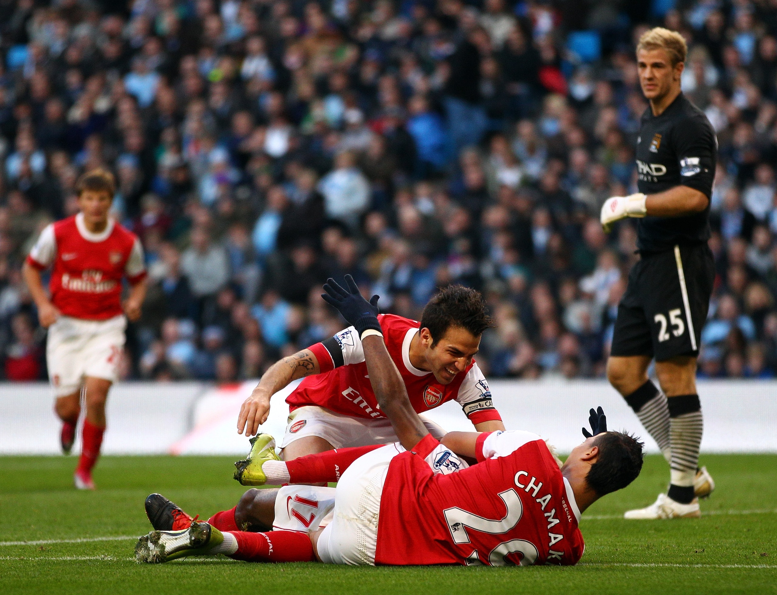MANCHESTER, ENGLAND - OCTOBER 24:  Alex Song of Arsenal is congratulated by his teammates after scoring the second goal during the Barclays Premier League match between Manchester City and Arsenal at City of Manchester Stadium on October 24, 2010 in Manch