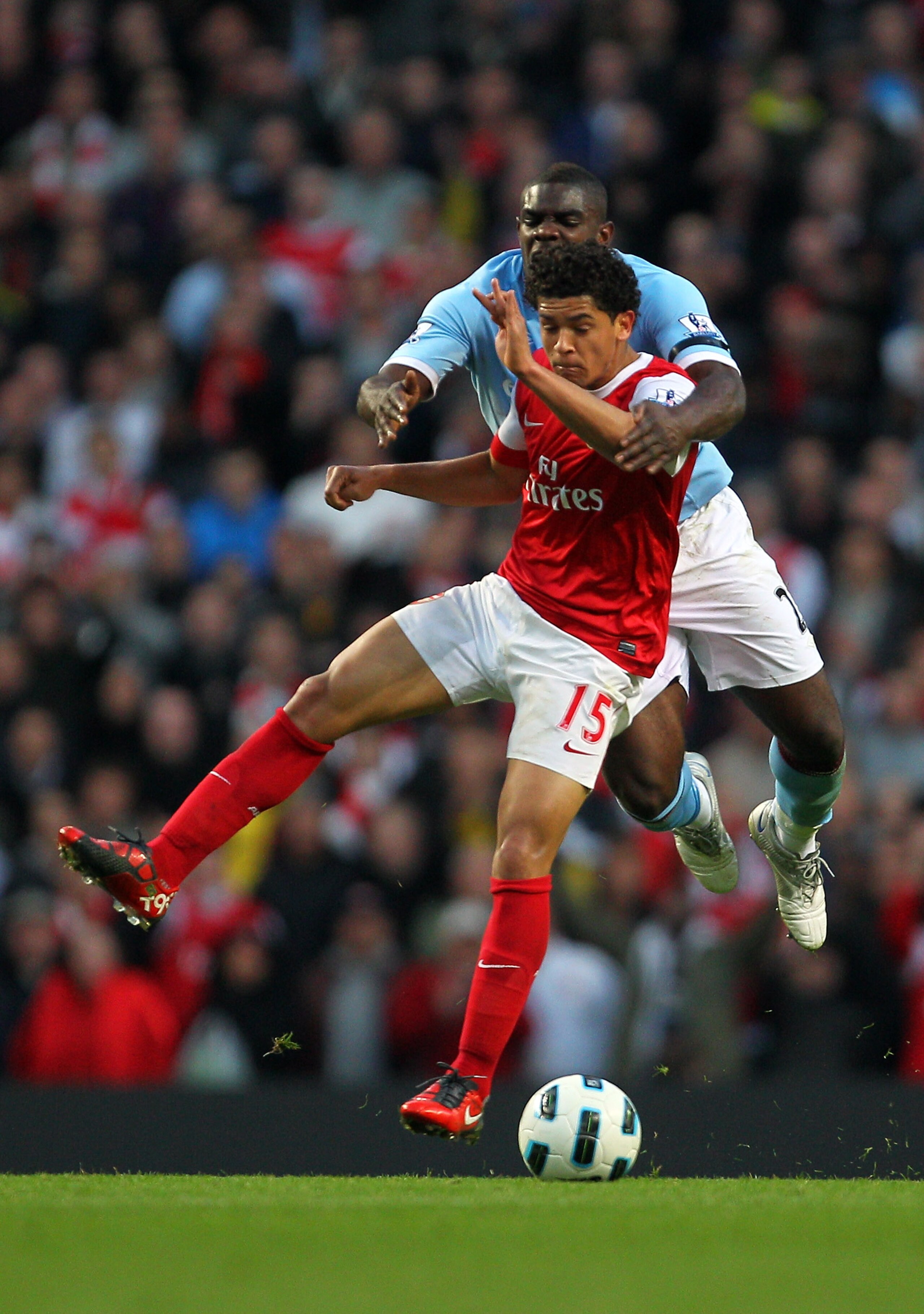 MANCHESTER, ENGLAND - OCTOBER 24:  Denilson of Arsenal is challenged by Micah Richards of Manchester City during the Barclays Premier League match between Manchester City and Arsenal at City of Manchester Stadium on October 24, 2010 in Manchester, England