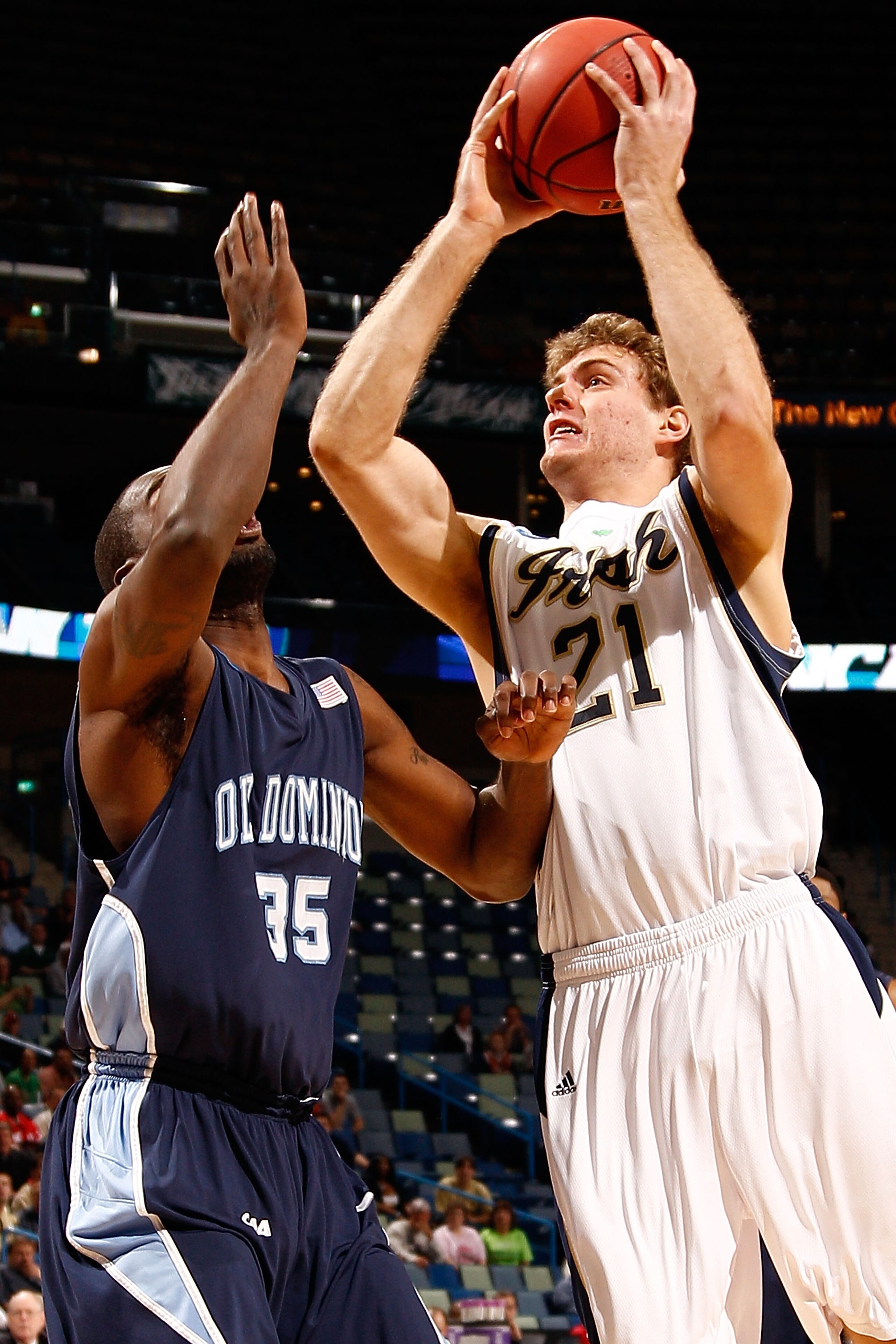 NEW ORLEANS - MARCH 18:  Tim Abromaitis #21 of the Notre Dame Fighting Irish shoots the ball over Ben Finney #35 of the Old Dominion Monarchs during the first round of the 2010 NCAA men's basketball tournament at the New Orleans Arena on March 18, 2010 in