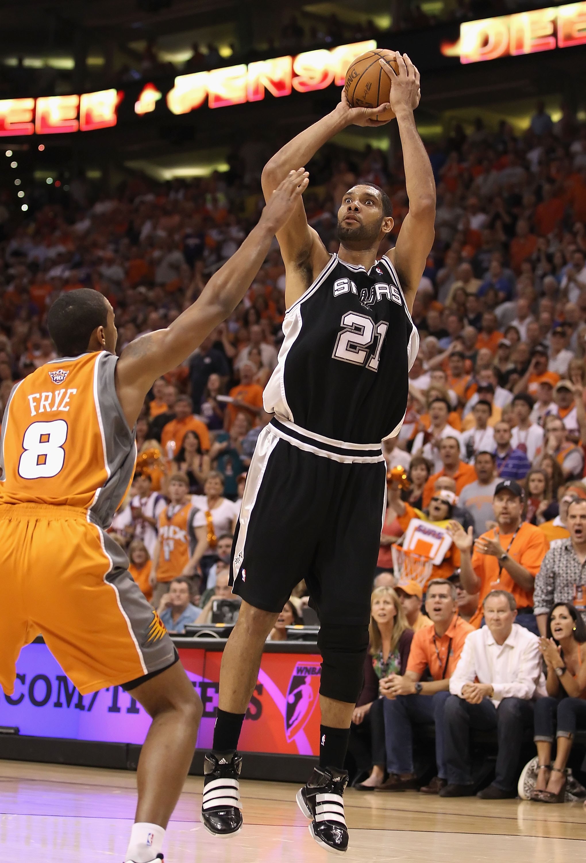 PHOENIX - MAY 05:  Tim Duncan #21 of the San Antonio Spurs shoots the ball during Game Two of the Western Conference Semifinals of the 2010 NBA Playoffs against the Phoenix Suns at US Airways Center on May 5, 2010 in Phoenix, Arizona. The team is wearing