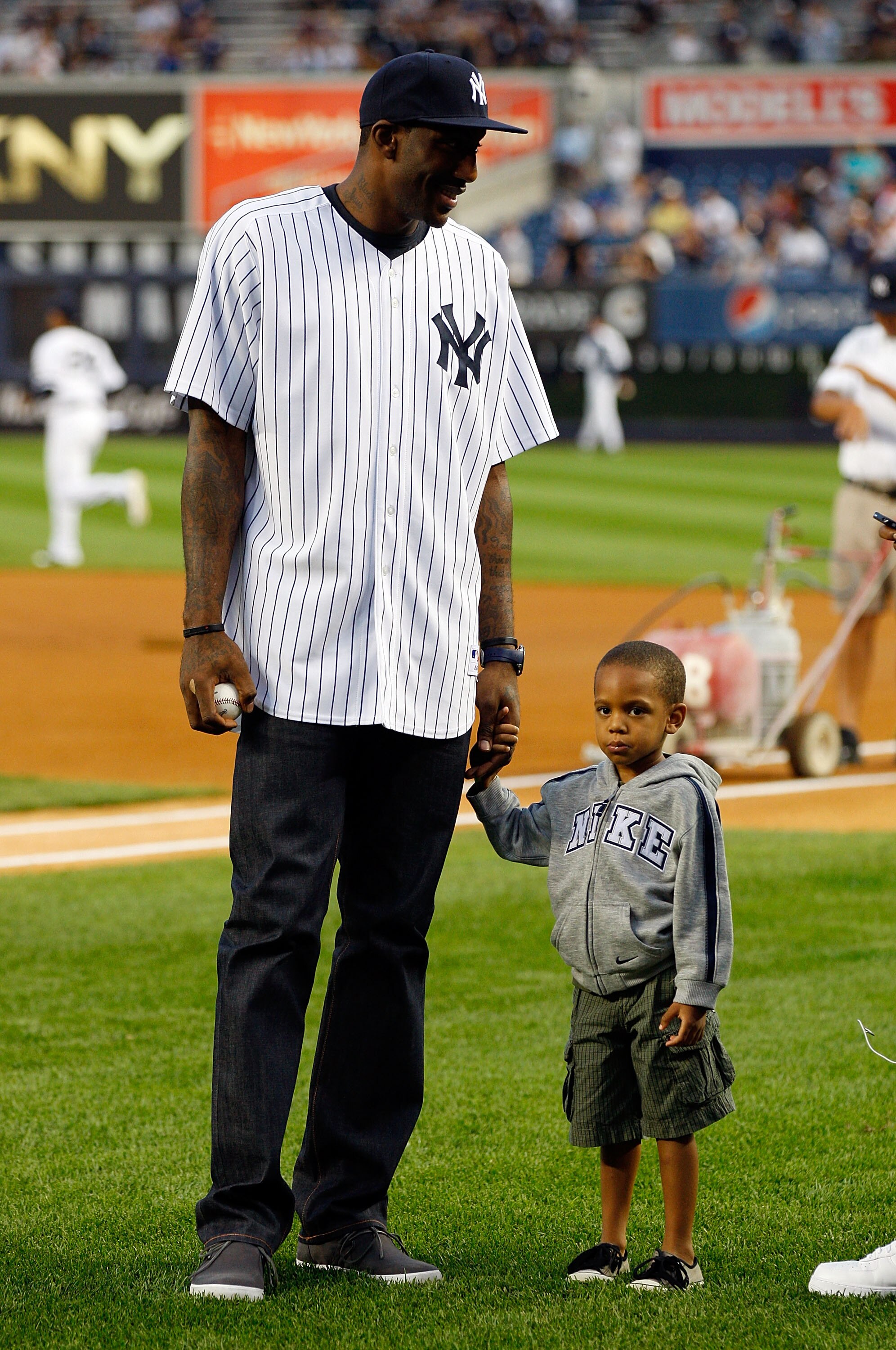 NEW YORK - SEPTEMBER 23:  Amar'e Stoudemire of the New York Knicks and his son Amar'e Jr. look on prior to the game between the New York Yankees and the Tampa Bay Rays on September 23, 2010 at Yankee Stadium in the Bronx borough of New York City.  (Photo