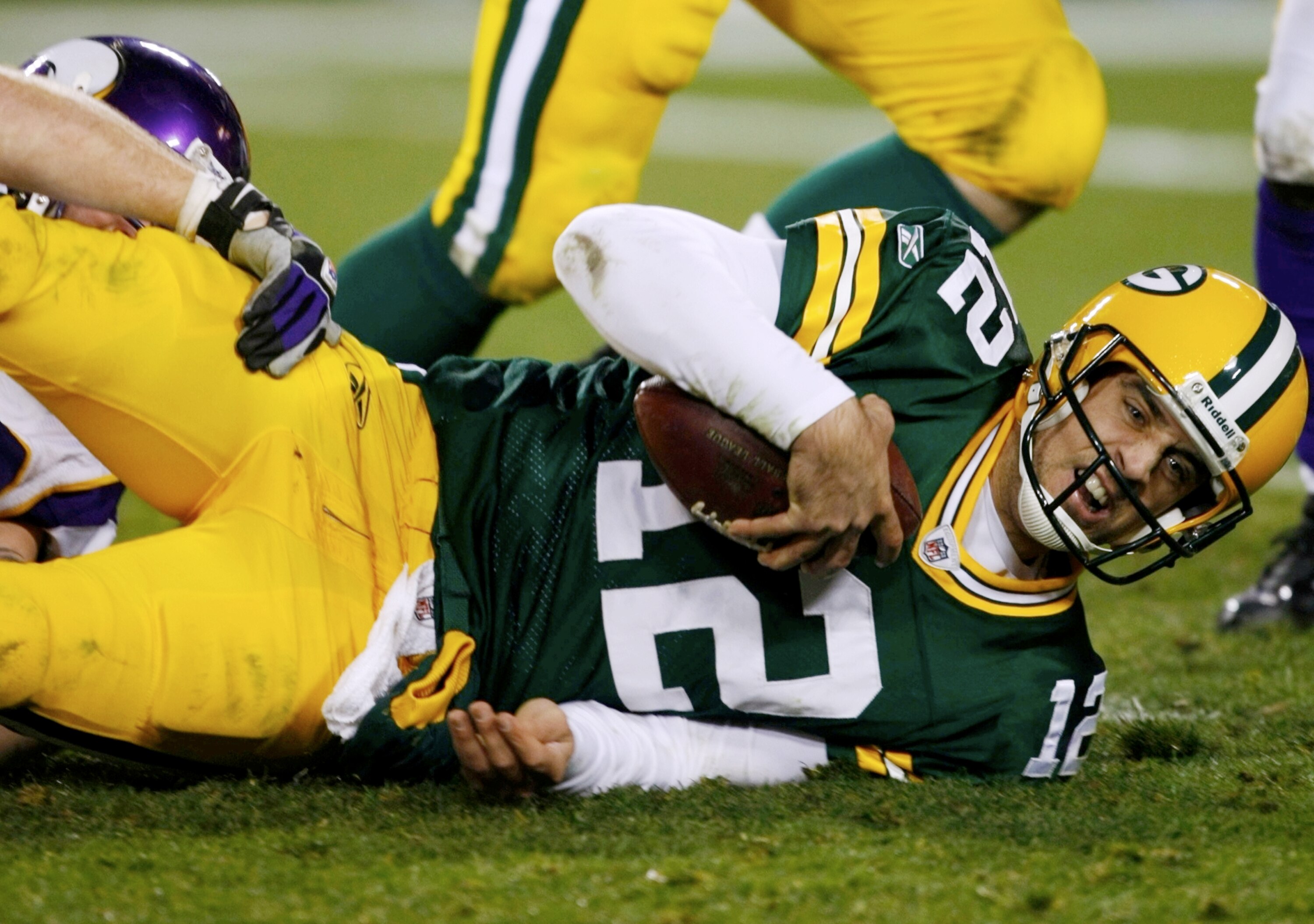 GREEN BAY, WI - NOVEMBER 01:  Quarterback Aaron Rodgers #12 of the Green Bay Packers is sacked during the third quarter of the game against the Minnesota Vikings at Lambeau Field on November 1, 2009 in Green Bay, Wisconsin. (Photo by Scott Boehm/Getty Ima