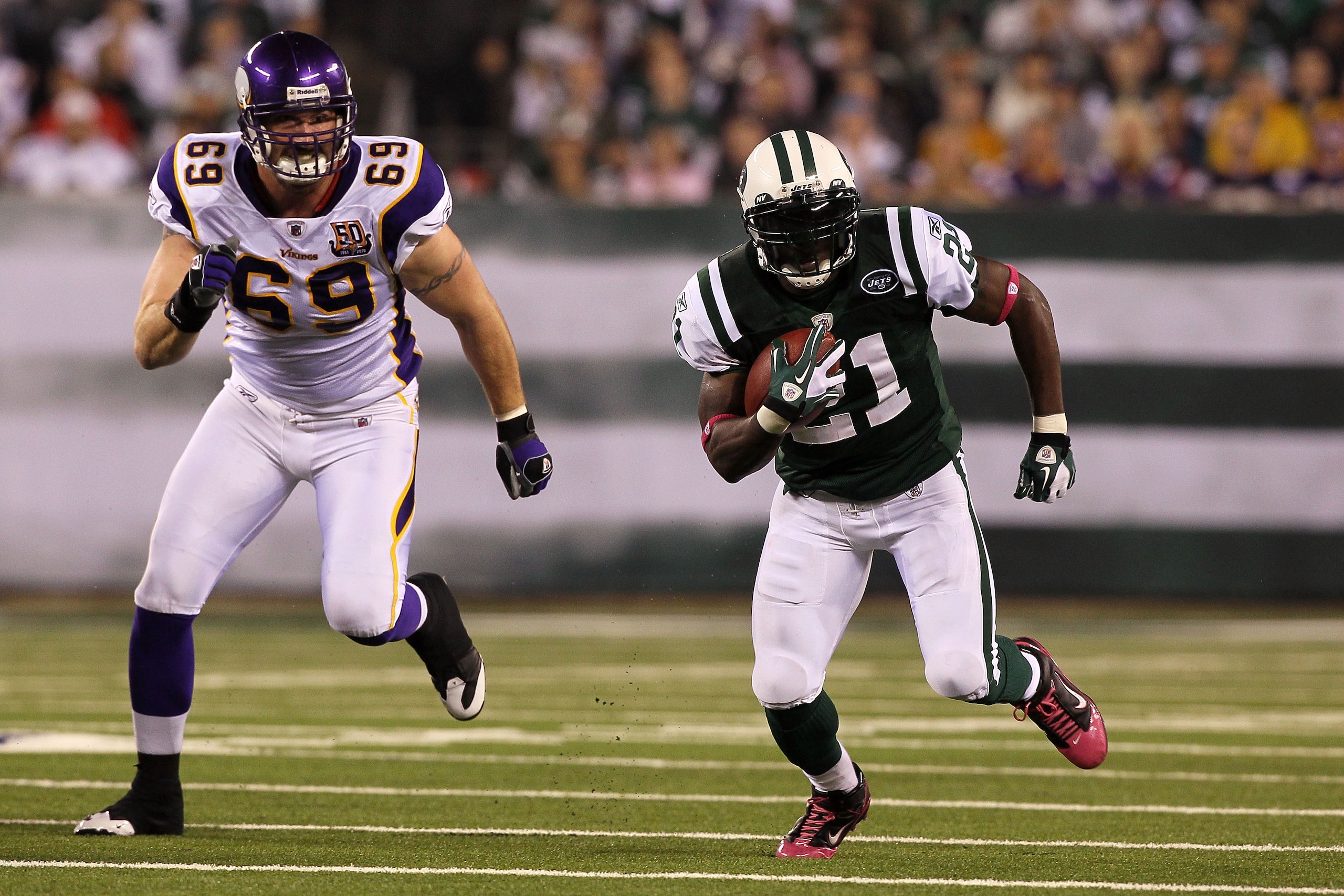 EAST RUTHERFORD, NJ - OCTOBER 11:  LaDainian Tomlinson #21 of the New York Jets runs the ball in the first half against Jared Allen #69 of the Minnesota Vikings at New Meadowlands Stadium on October 11, 2010 in East Rutherford, New Jersey.  (Photo by Jim