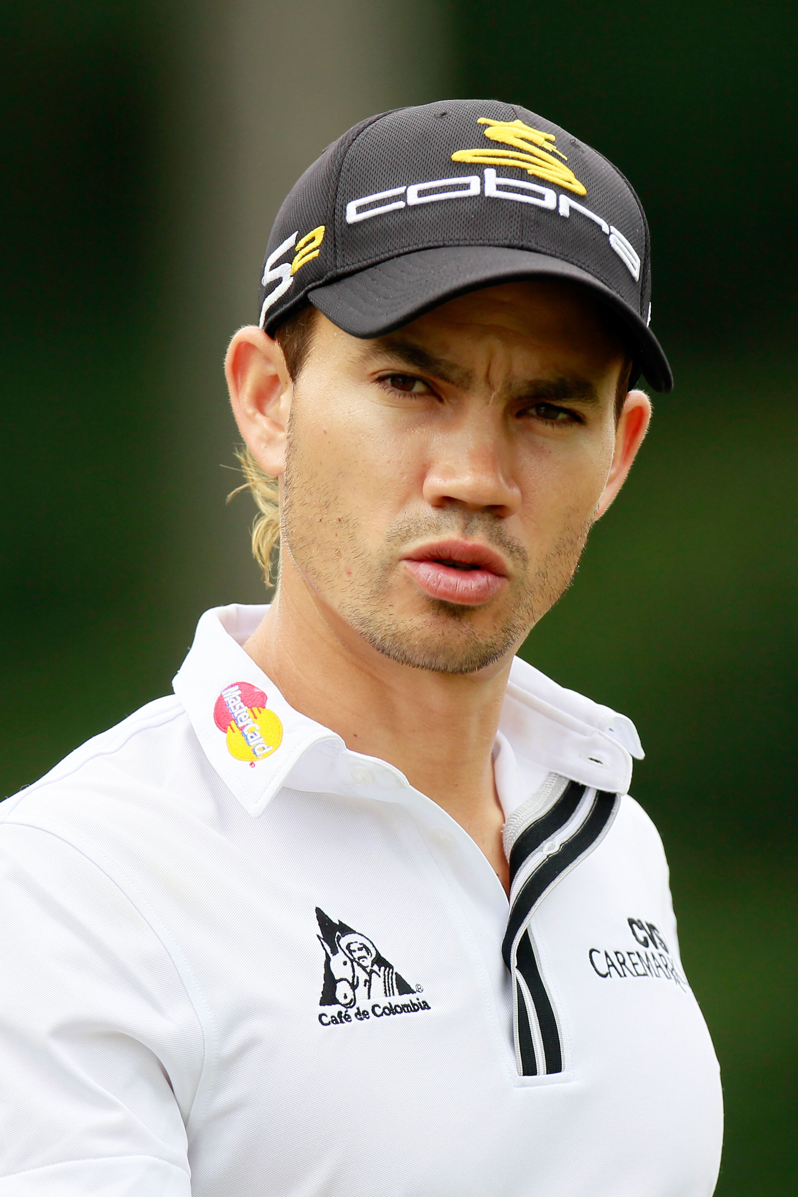 ATLANTA - SEPTEMBER 26:  Camilo Villegas walks off the eighth tee during the final round of THE TOUR Championship presented by Coca-Cola at East Lake Golf Club on September 26, 2010 in Atlanta, Georgia.  (Photo by Kevin C. Cox/Getty Images)