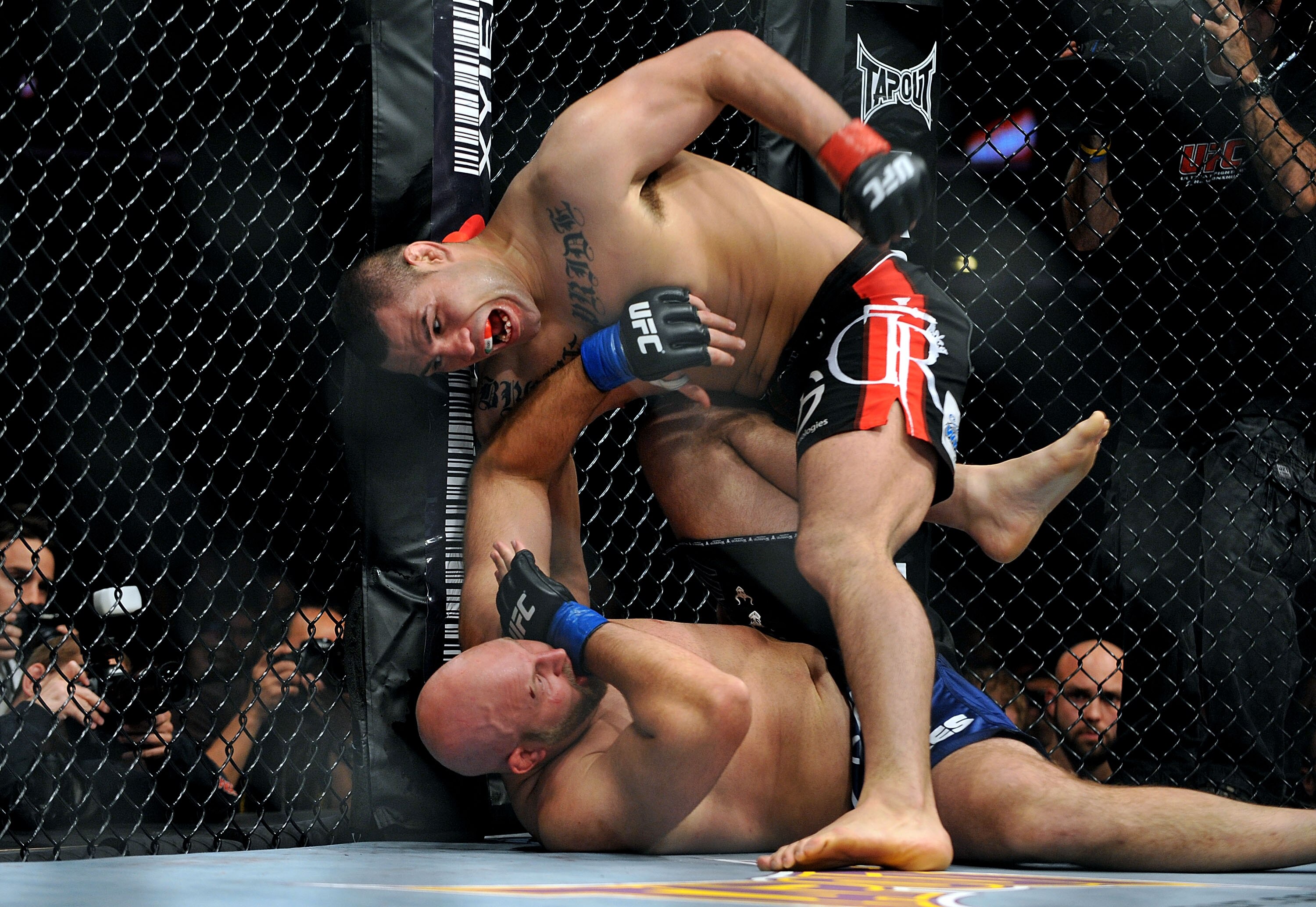 LOS ANGELES, CA - OCTOBER 24:  UFC fighter Cain Velasquez (top) battles with UFC fighter Ben Rothwell (bottom) during their Heavyweight bout at UFC 104: Machida vs. Shogun at Staples Center on October 24, 2009 in Los Angeles, California.  (Photo by Jon Ko